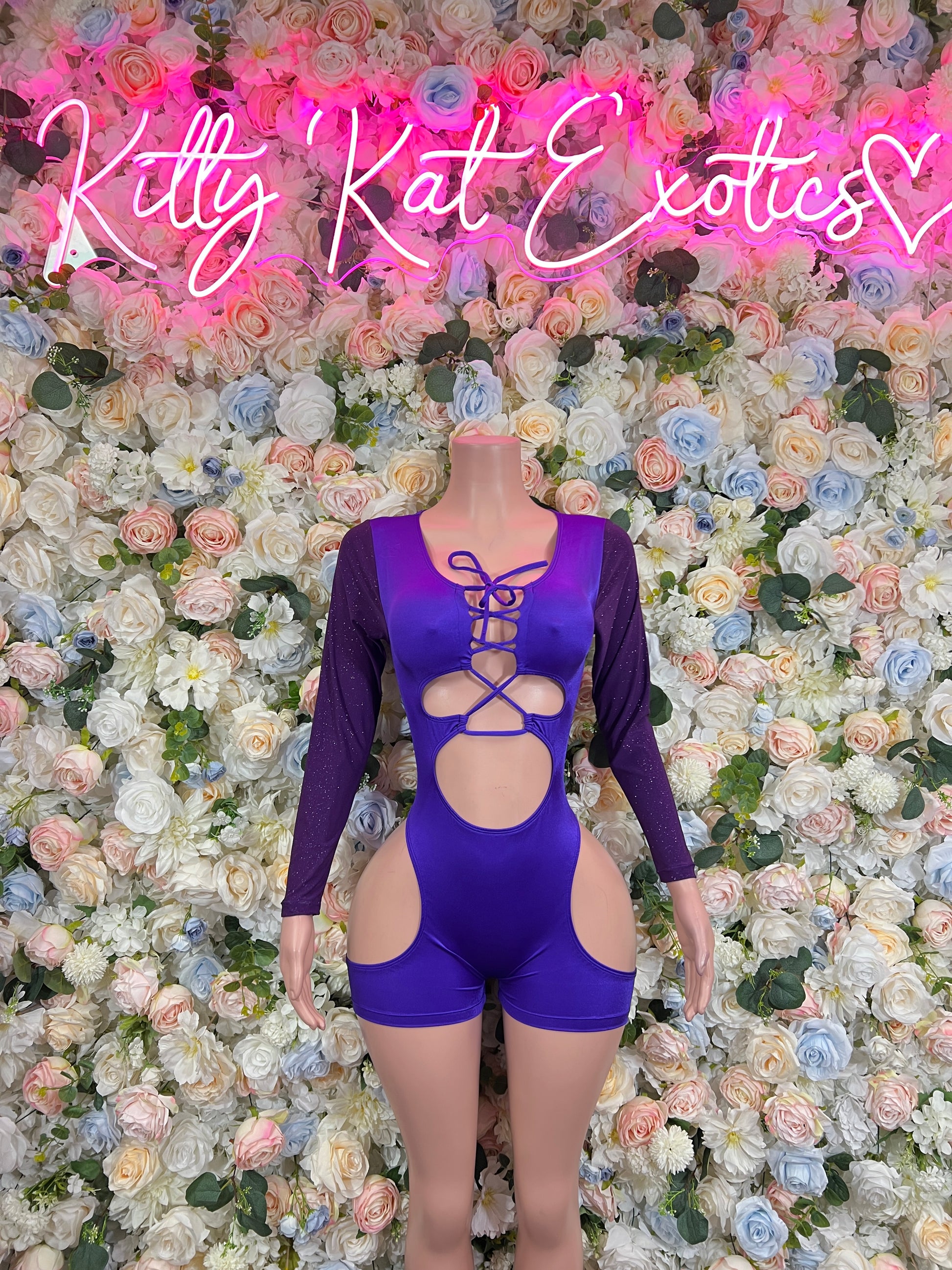 Purple long-sleeve bodysuit with crisscross lace-up front and high-cut legs
