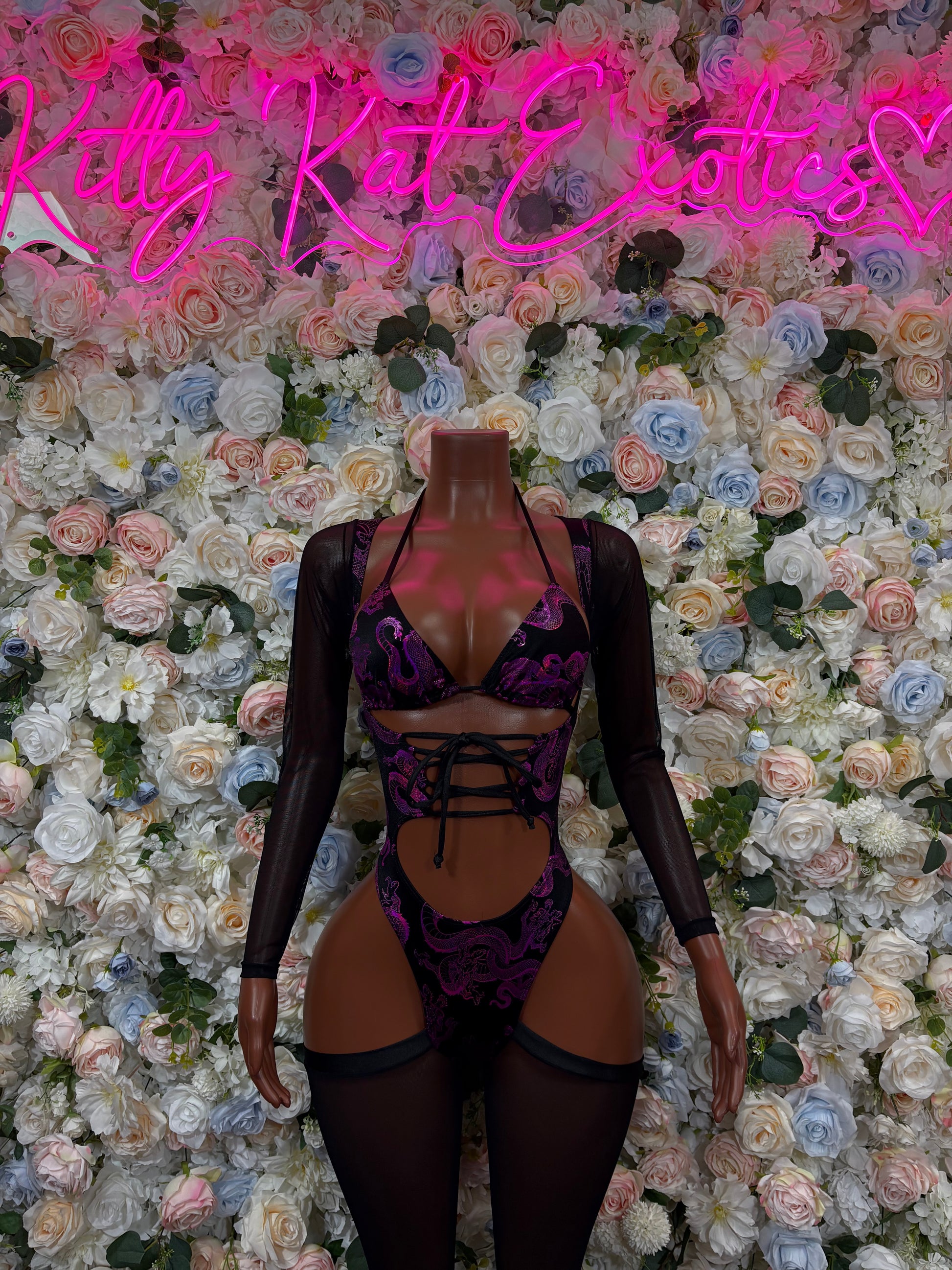 Purple dragon print long-sleeve bodysuit with strappy cutouts and high-leg bottoms
