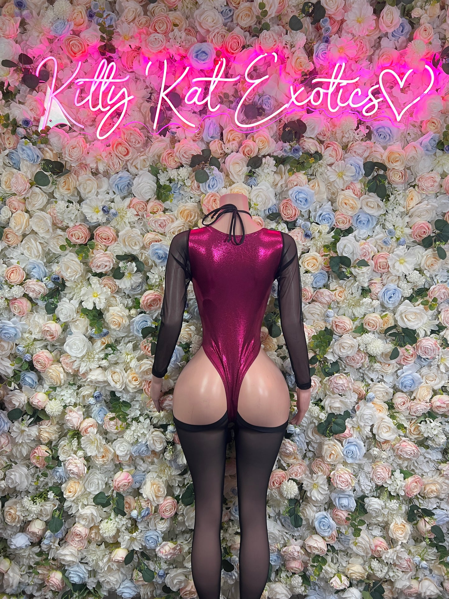 Burgundy satin bodysuit with sheer sleeves and crisscross lace-up back