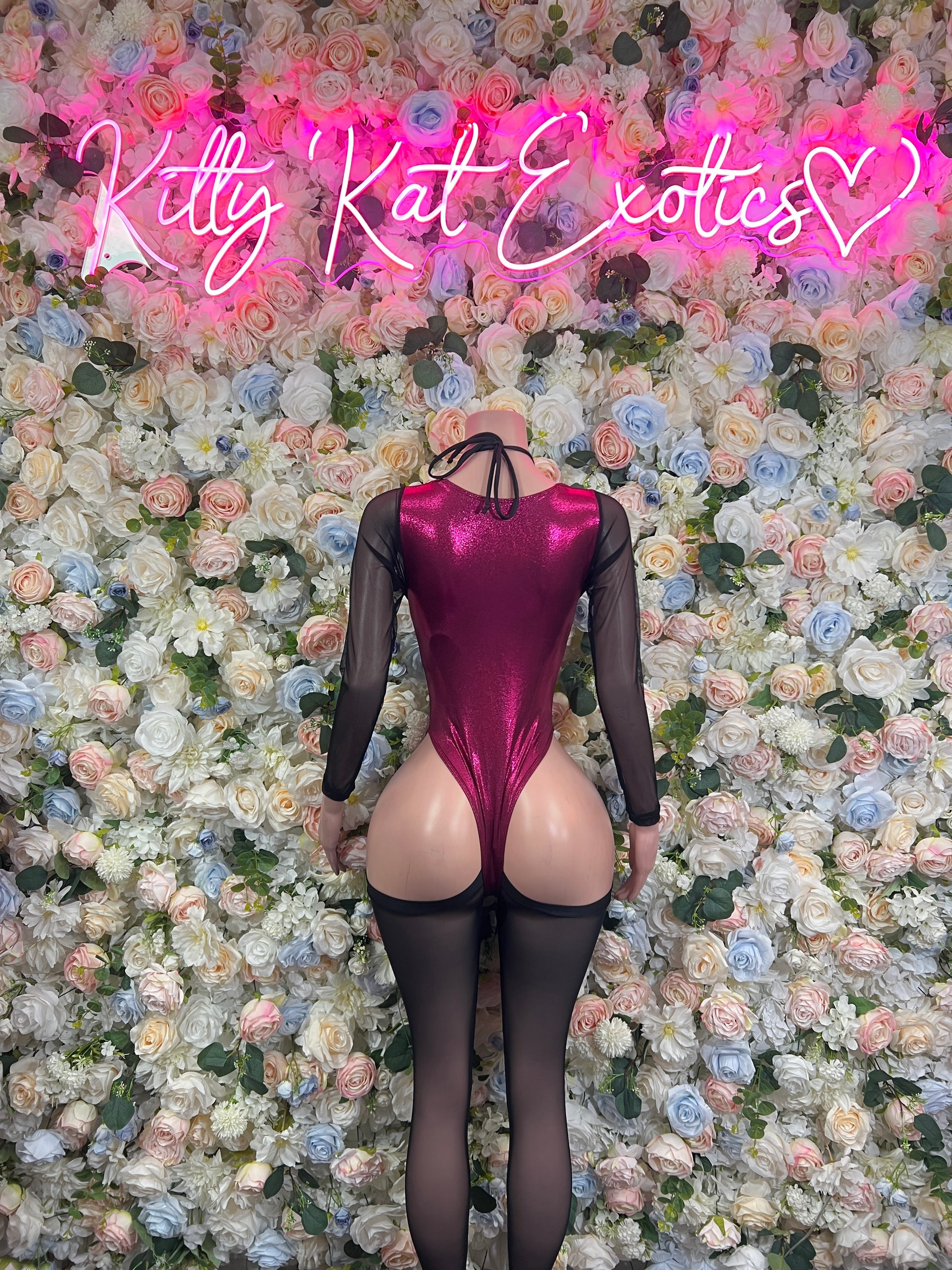 Burgundy satin bodysuit with sheer sleeves and crisscross lace-up back