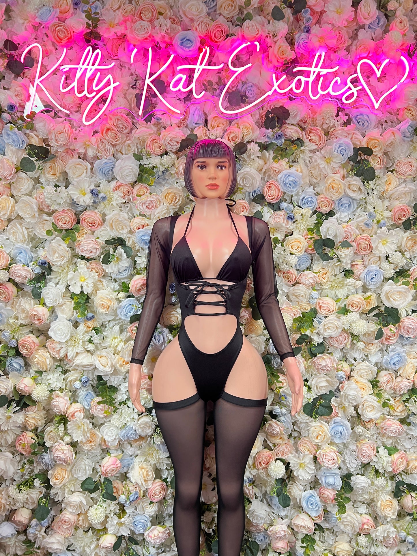 Black sheer long-sleeve bodysuit with lace-up cutouts