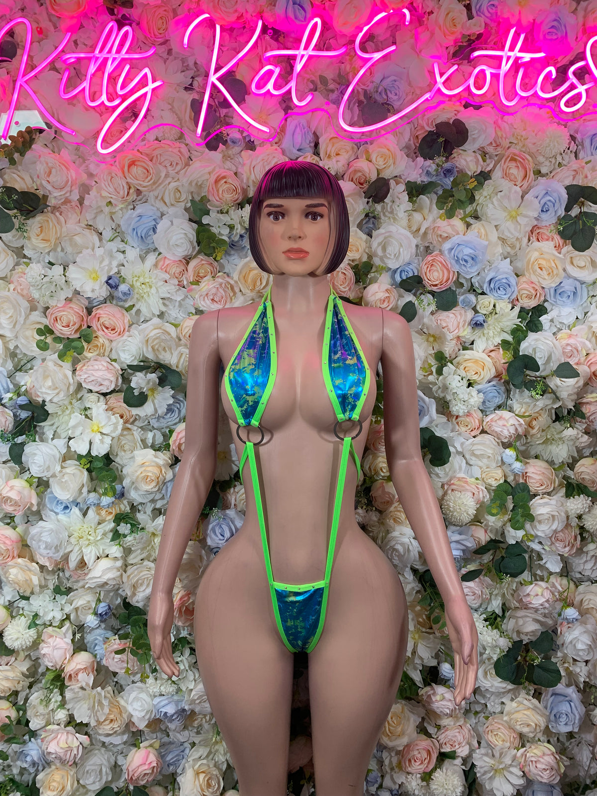 Neon green rave bodysuit with strappy front and high-cut thong bottoms