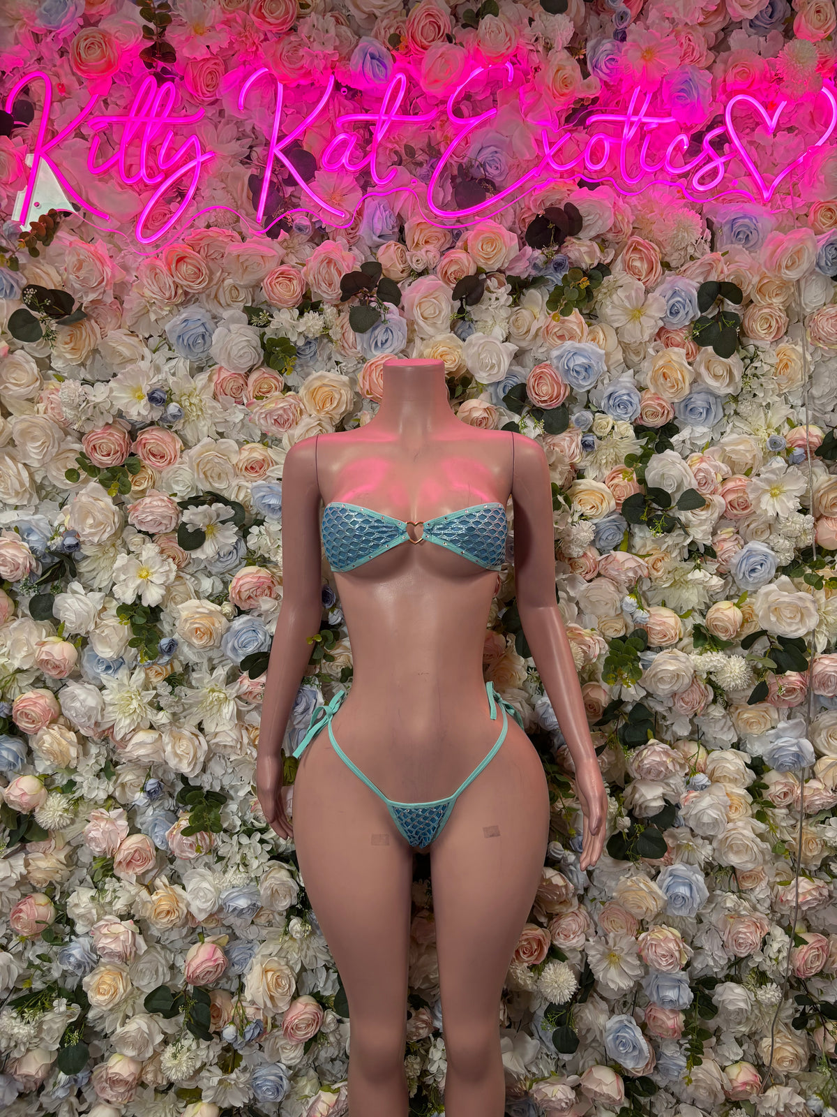 Turquoise two-piece bikini with strappy triangle top and tie briefs, front view