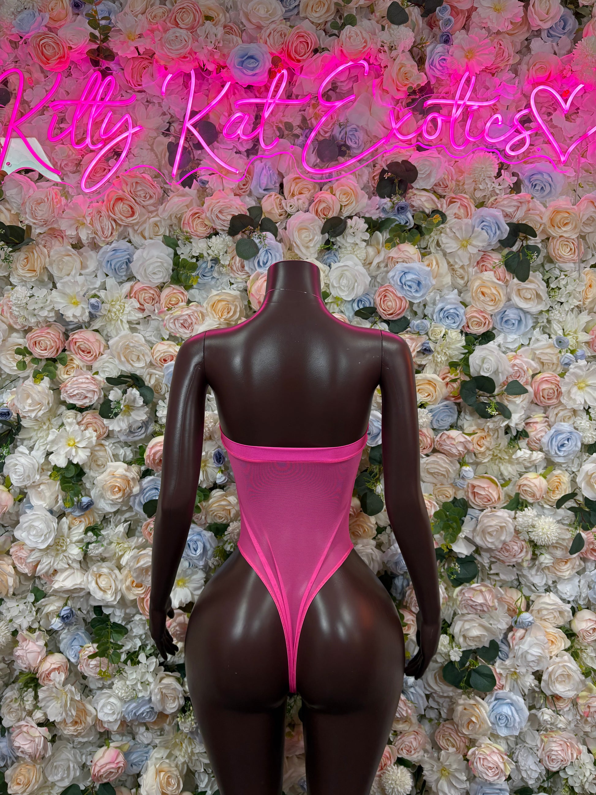 Rave bodysuit with hot pink bandeau neckline and dark mesh