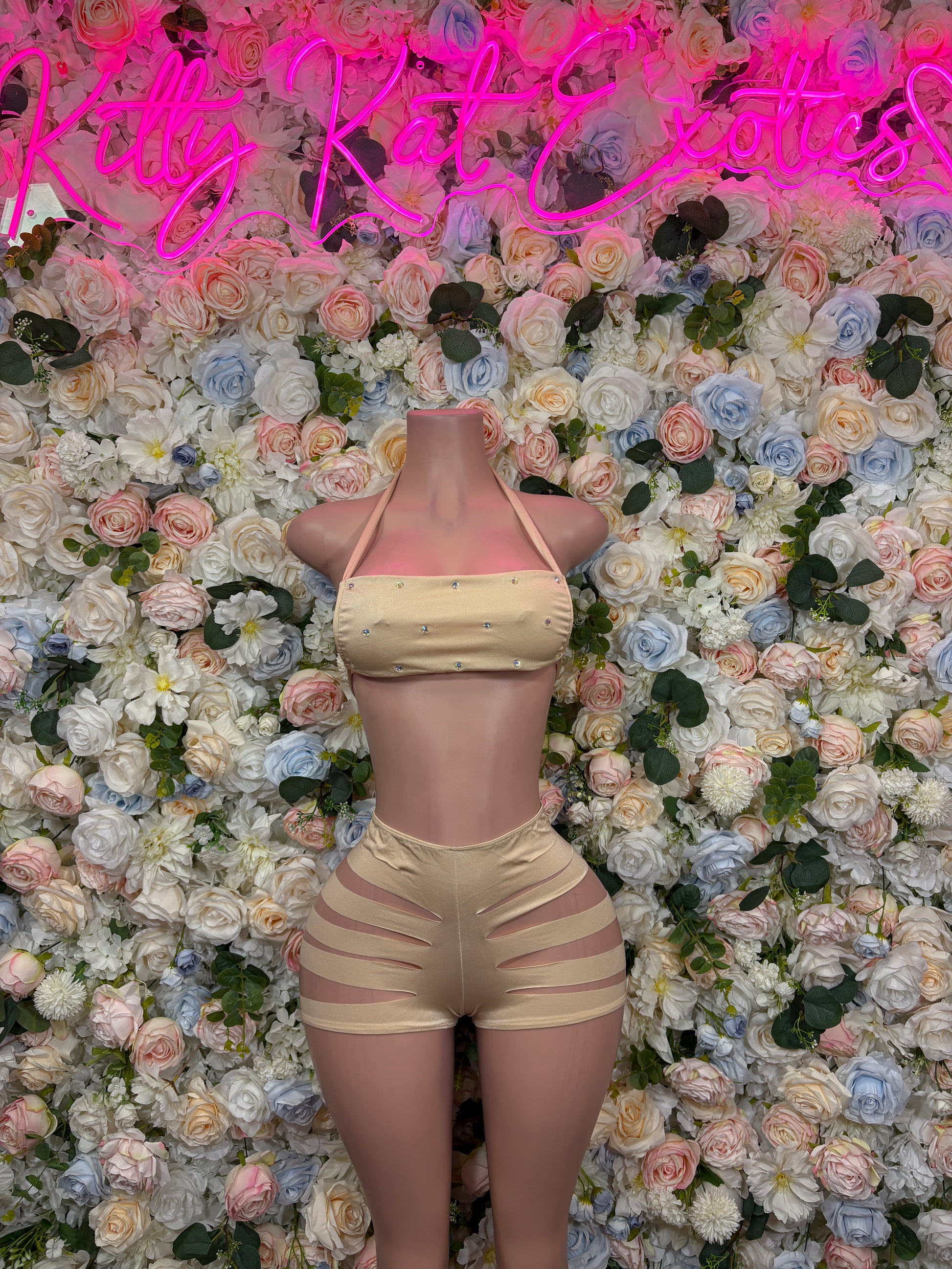 Cream halter triangle crop top and strappy cutout shorts two-piece outfit, front view
