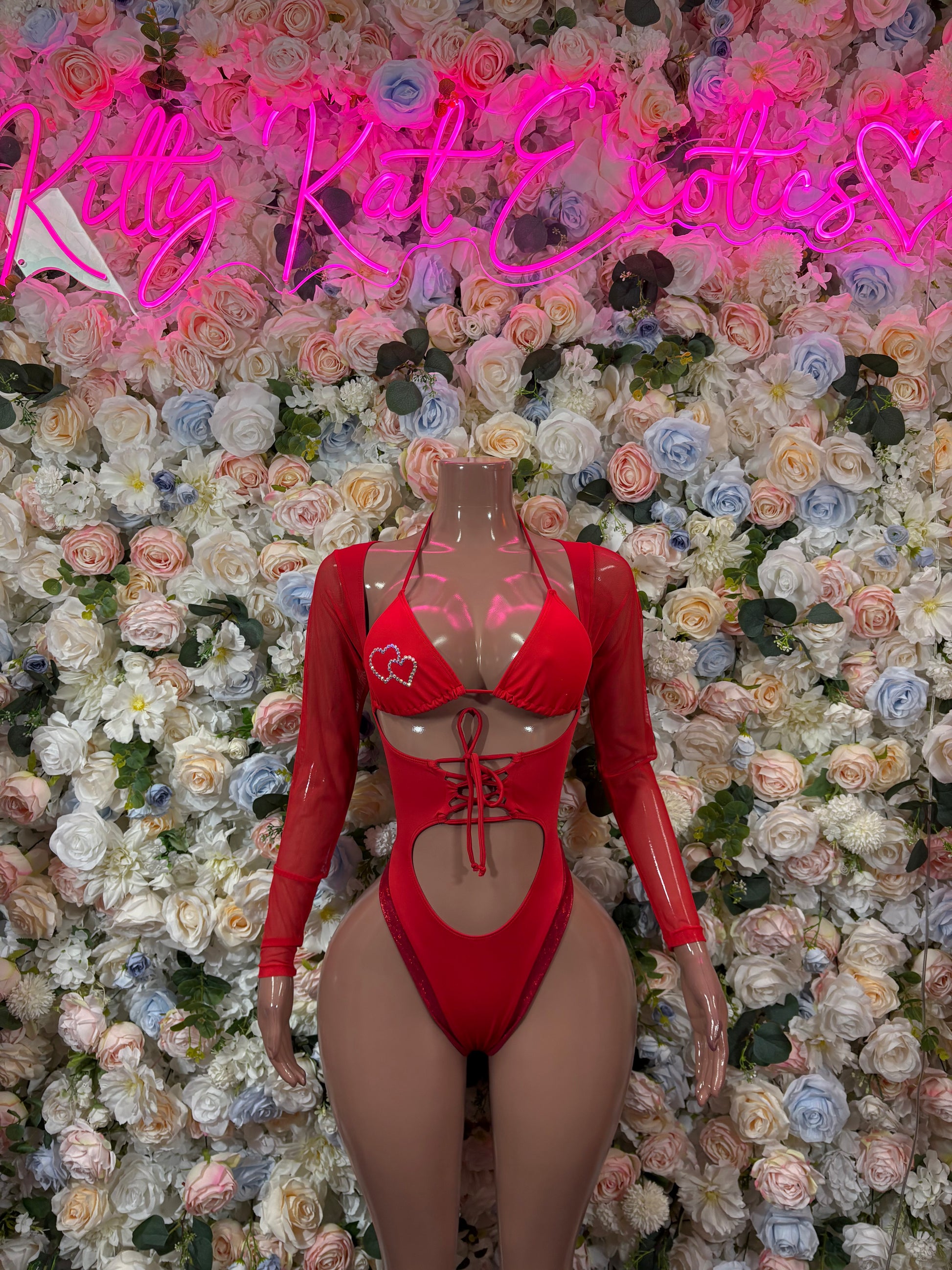 Red heart bodysuit with long sleeves, lace-up front and high-cut thong back