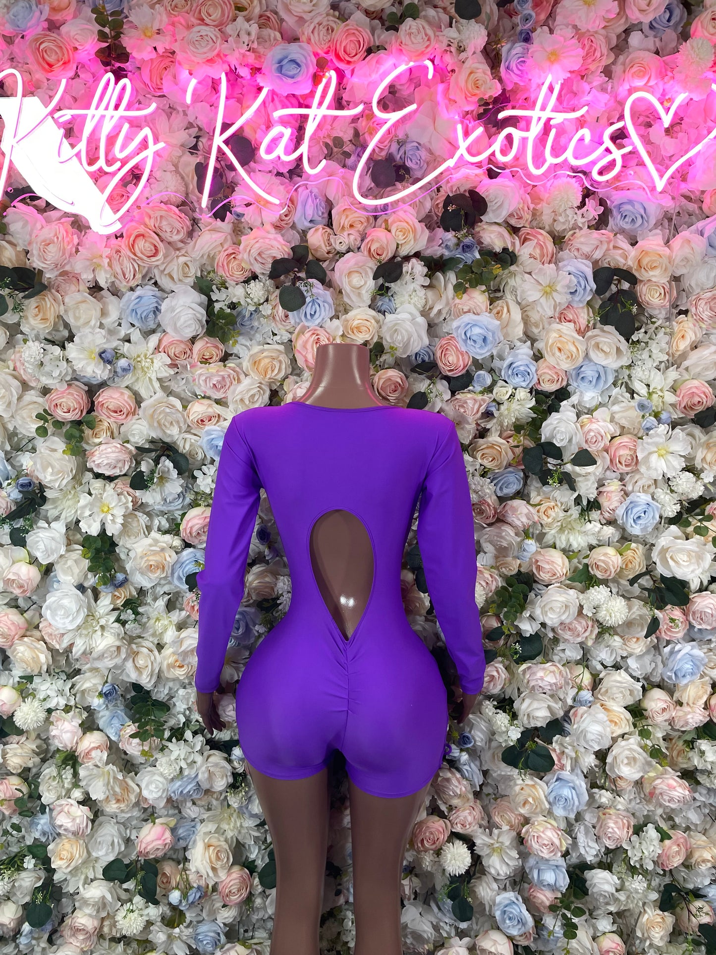 Purple long-sleeve bodysuit with open back V-shape cutout