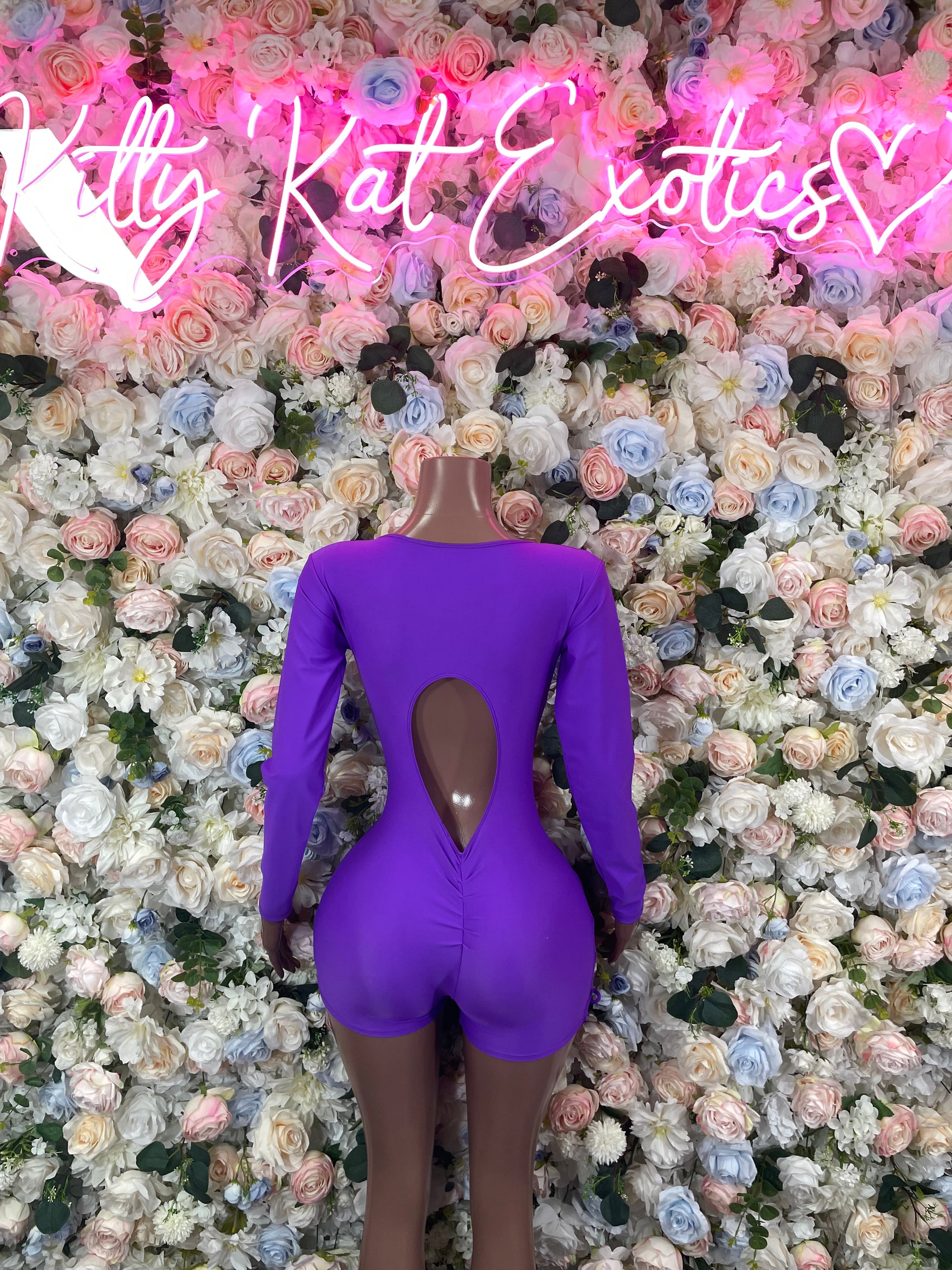 Purple long-sleeve bodysuit with open back V-shape cutout