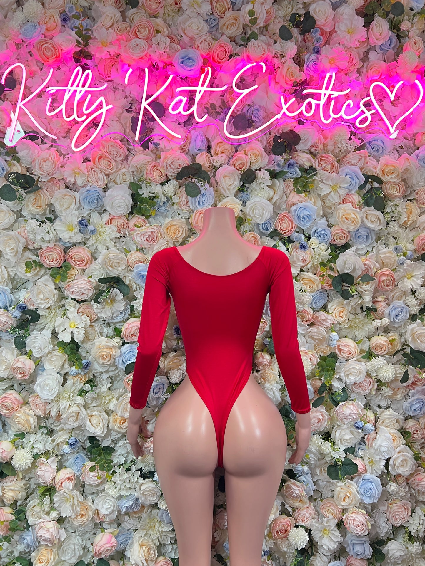 Red long-sleeve one-piece bodysuit with lace V-front and cheeky bottom cut