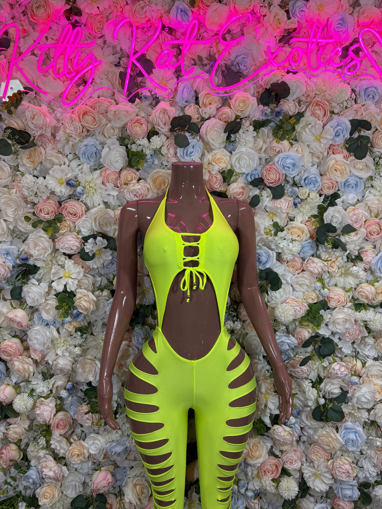 Neon yellow cut-out bodysuit with lace-up chest and striped leg cutouts