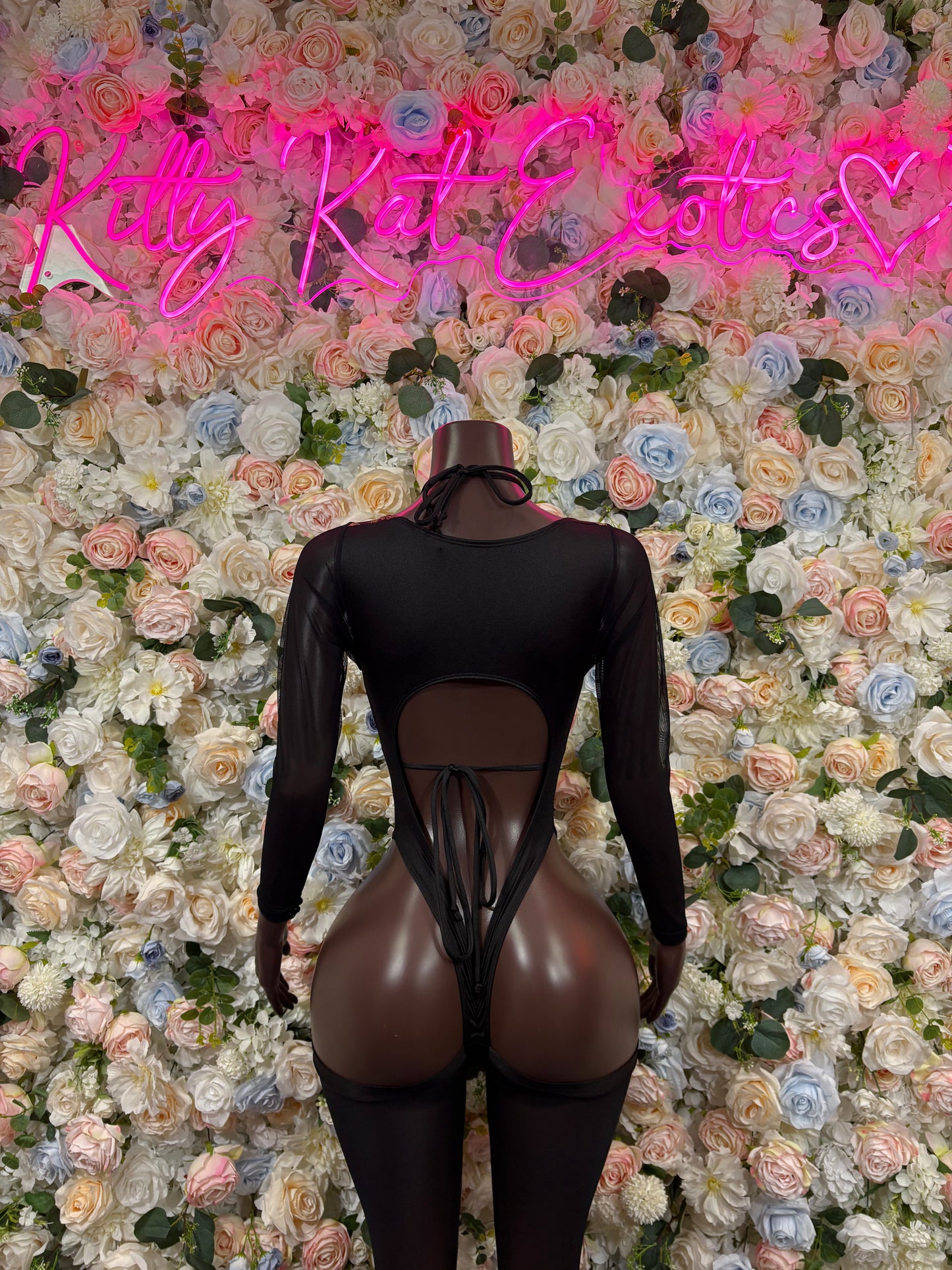 Black bodysuit with gold dragon print, long sleeves, back cutout and high-cut legs