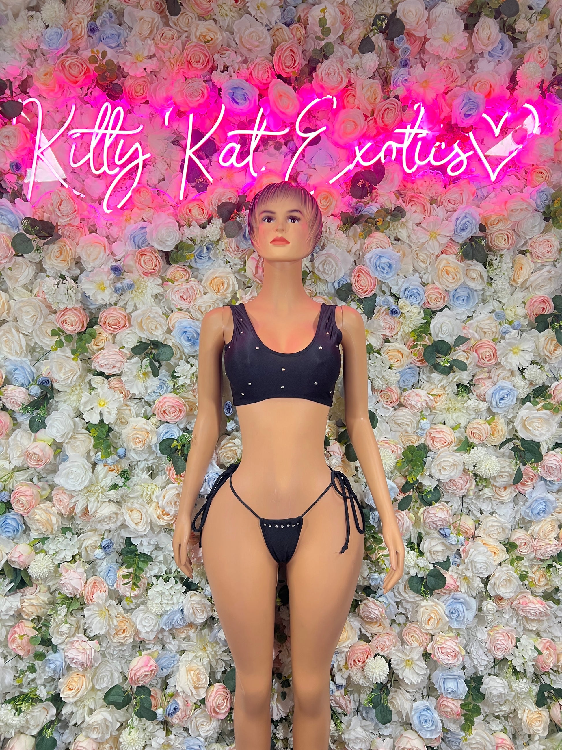 Black two-piece rhinestone bodysuit with tie-side bottoms and sparkly straps