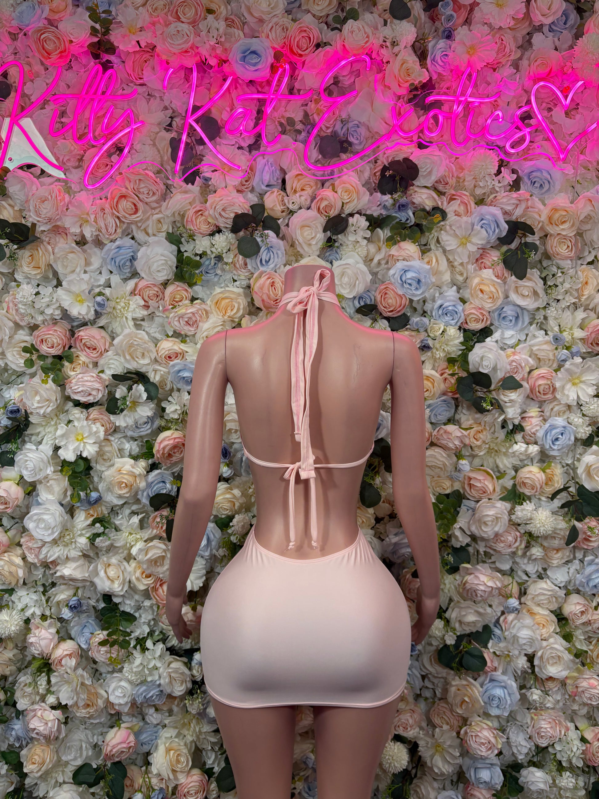 Light pink mini dress with halter back tie and strappy open back