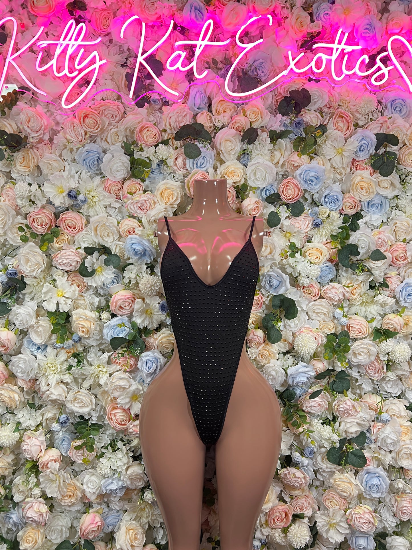 Dark rhinestone V-neck bodysuit with open back and small sparkle texture
