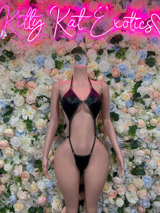 Black latex one-piece lingerie with deep V neckline and front cutout