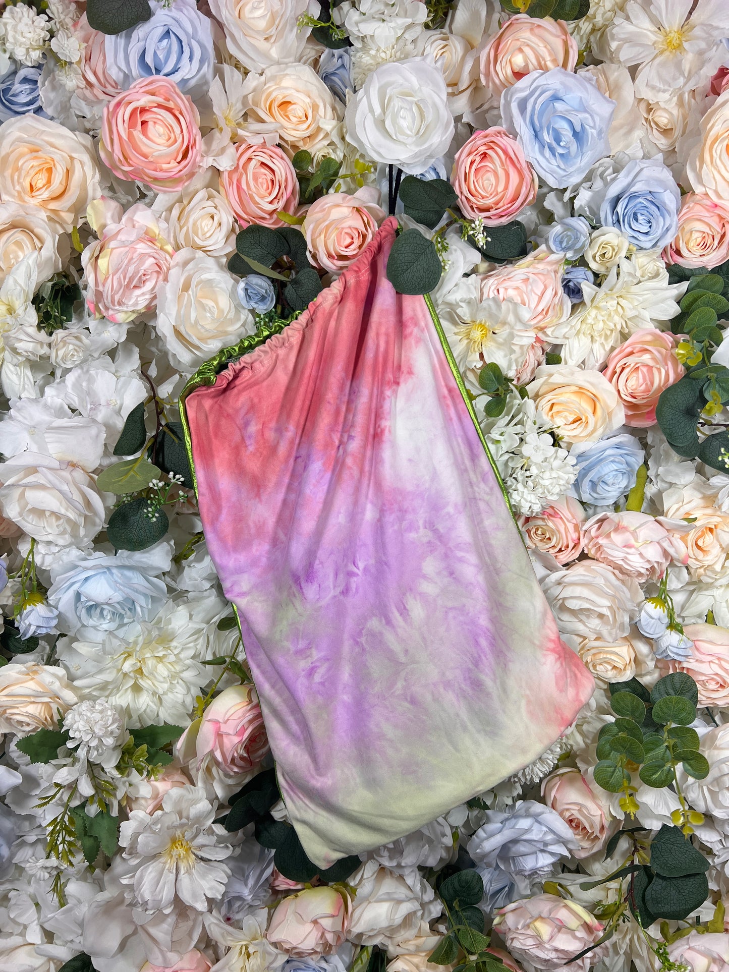 Multicolor metallic drawstring money bag with pink, purple, and green sheen