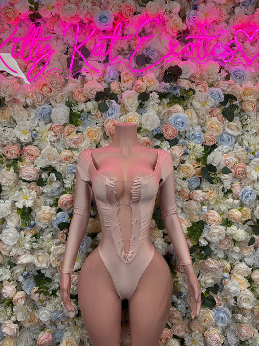 Nude one-piece bodysuit with corset-like seams and long sleeves