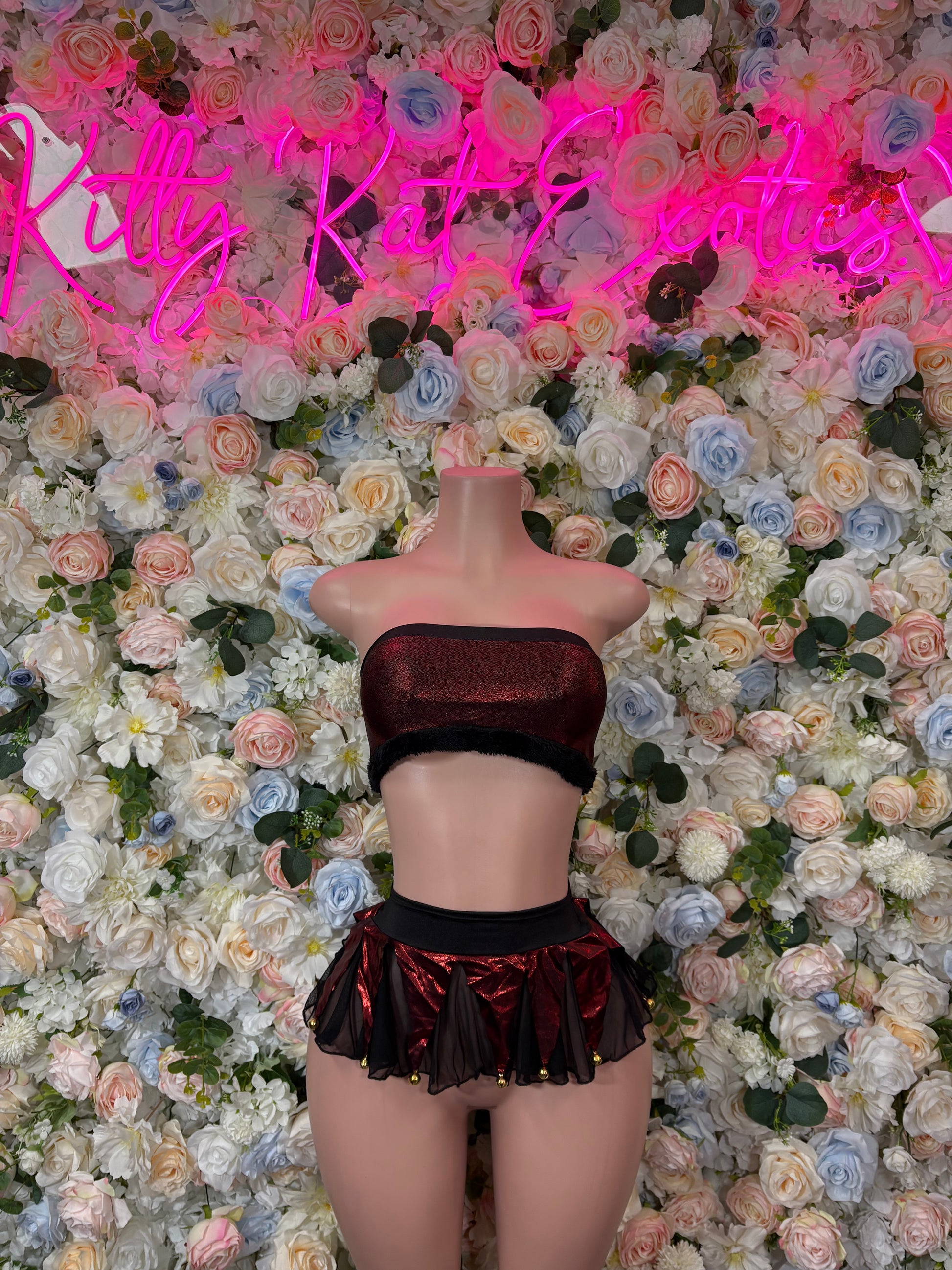 Women’s holiday bartender skirt set: black crop top, burgundy ruffle mini skirt.