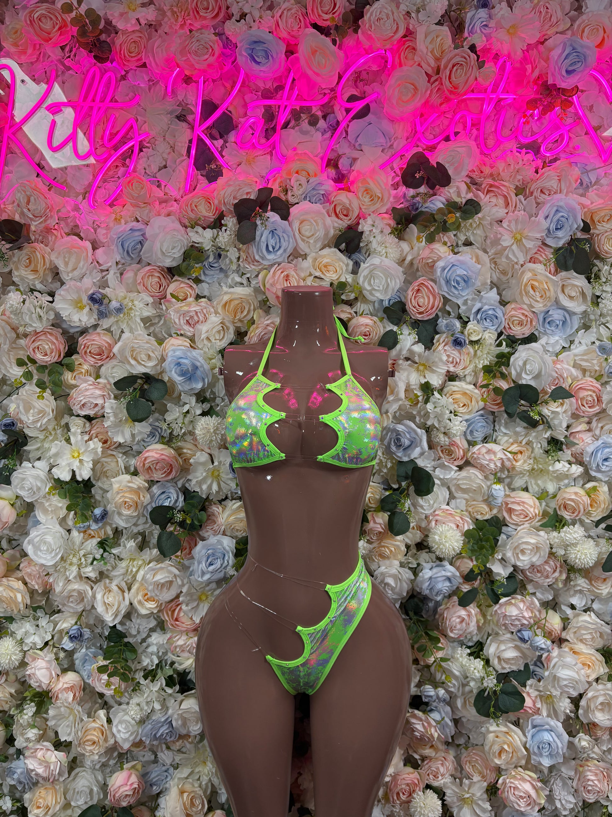 Two-piece hologram set with neon green triangle bikini top and matching bottoms