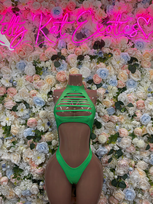 Green strappy bodysuit with open back and sheer panel