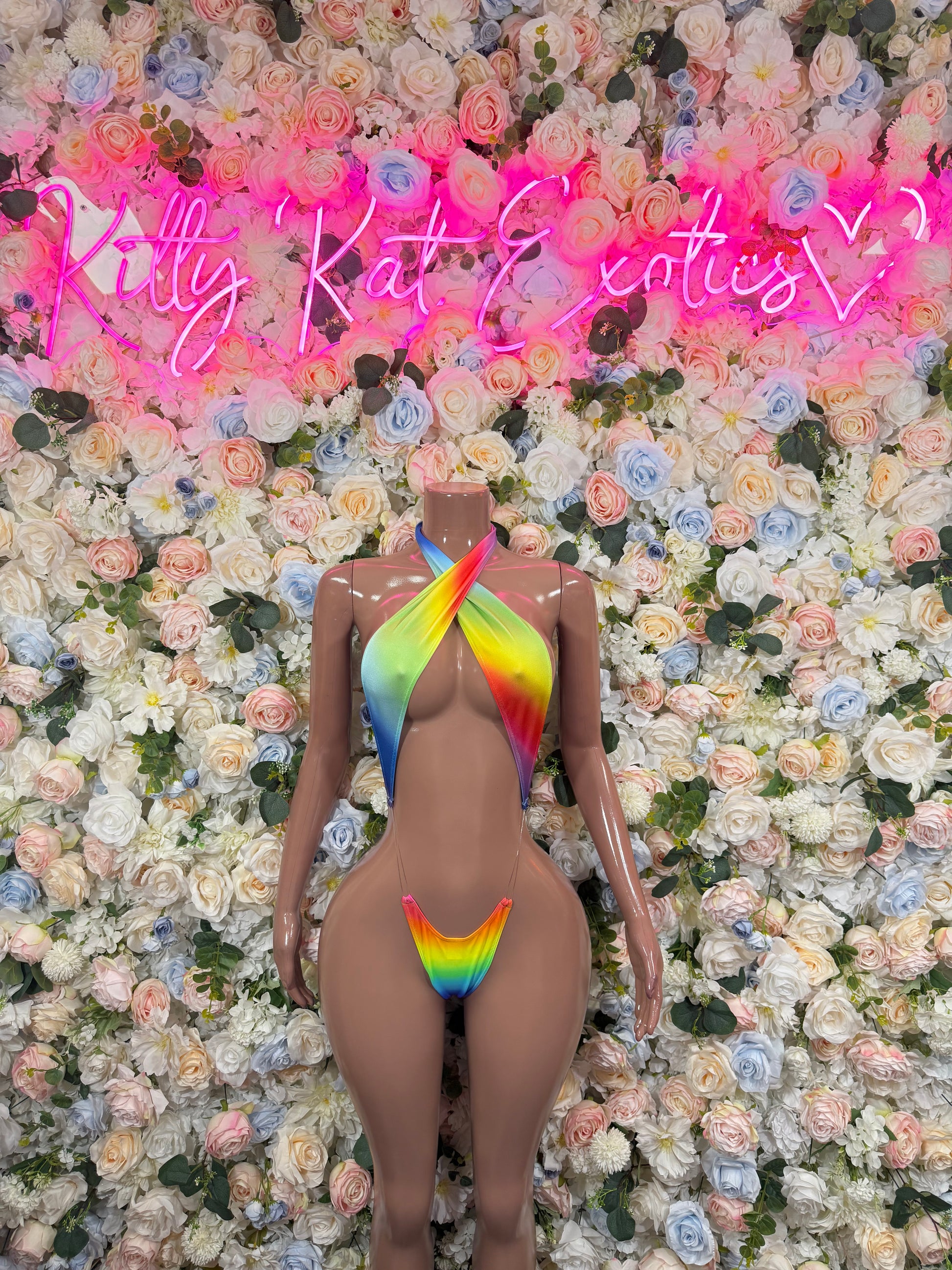 Multicolor one-piece rave bodysuit with rainbow flame motif and high-cut legs