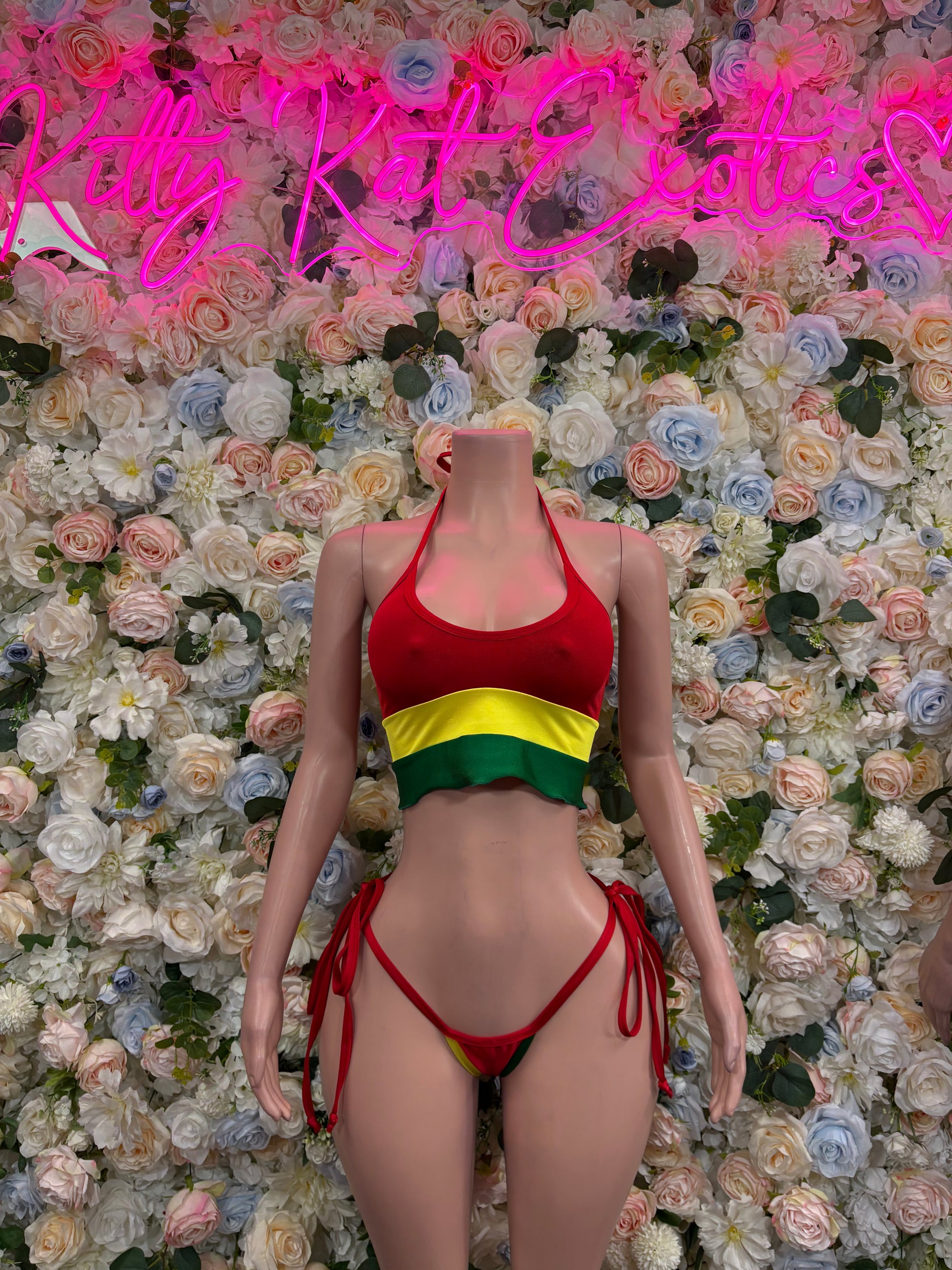 Red two-piece bikini swimsuit with yellow-green stripe; halter top and tie bottoms