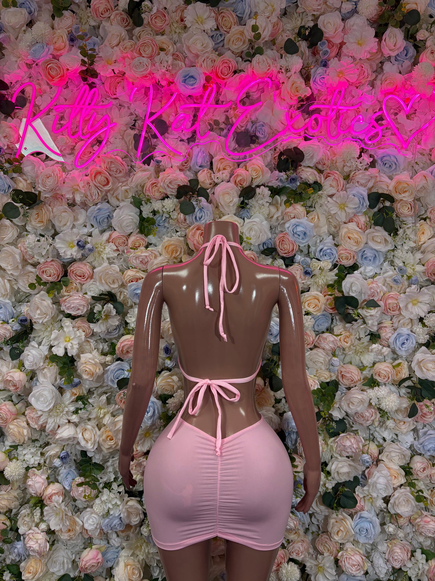 Pink ruched mini dress bodysuit with halter tie-back and ruched front