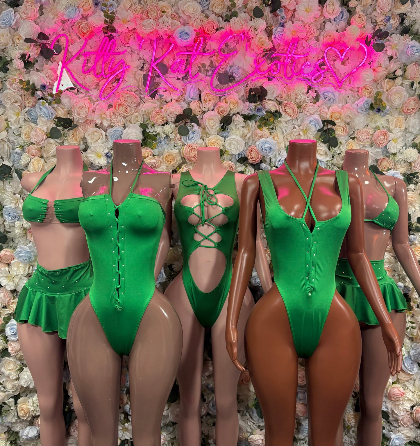 Set of green bodysuits, including lace-up and button front styles