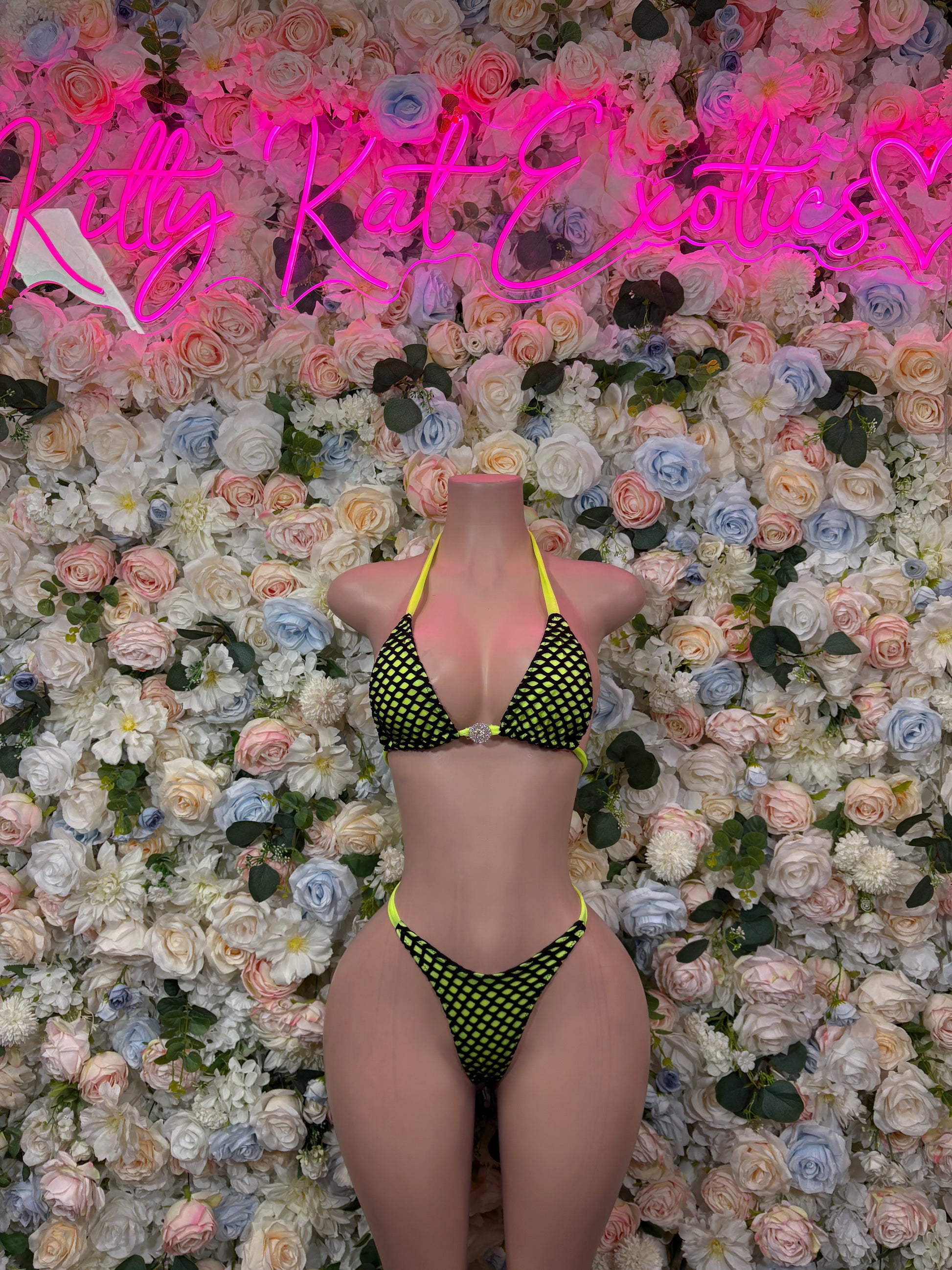 Neon green two-piece bikini set with black mesh triangle bra and matching briefs