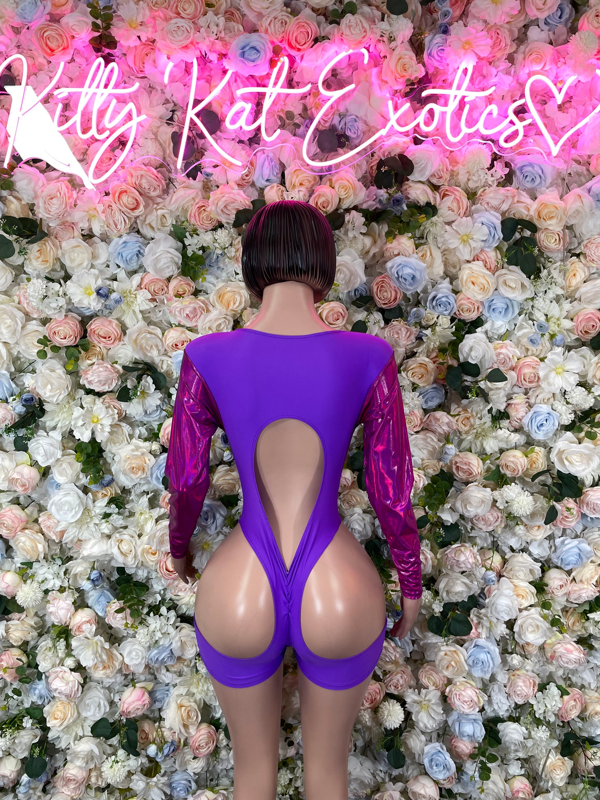 Purple one-piece bodysuit with open back and backless teardrop cutout