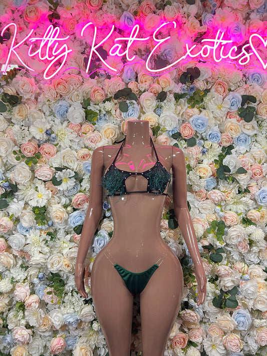 Emerald green feather-fringe bikini with halter straps and small bow detail on mannequin