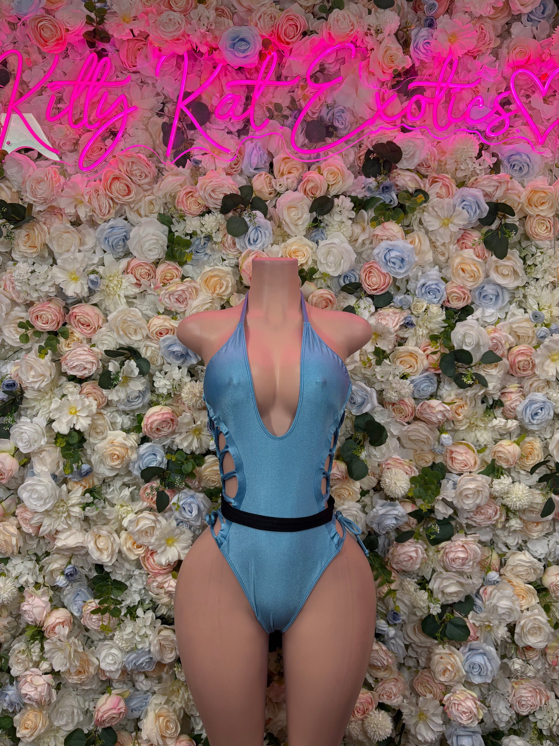 Baby blue one-piece bodysuit with open back and lace-up side straps