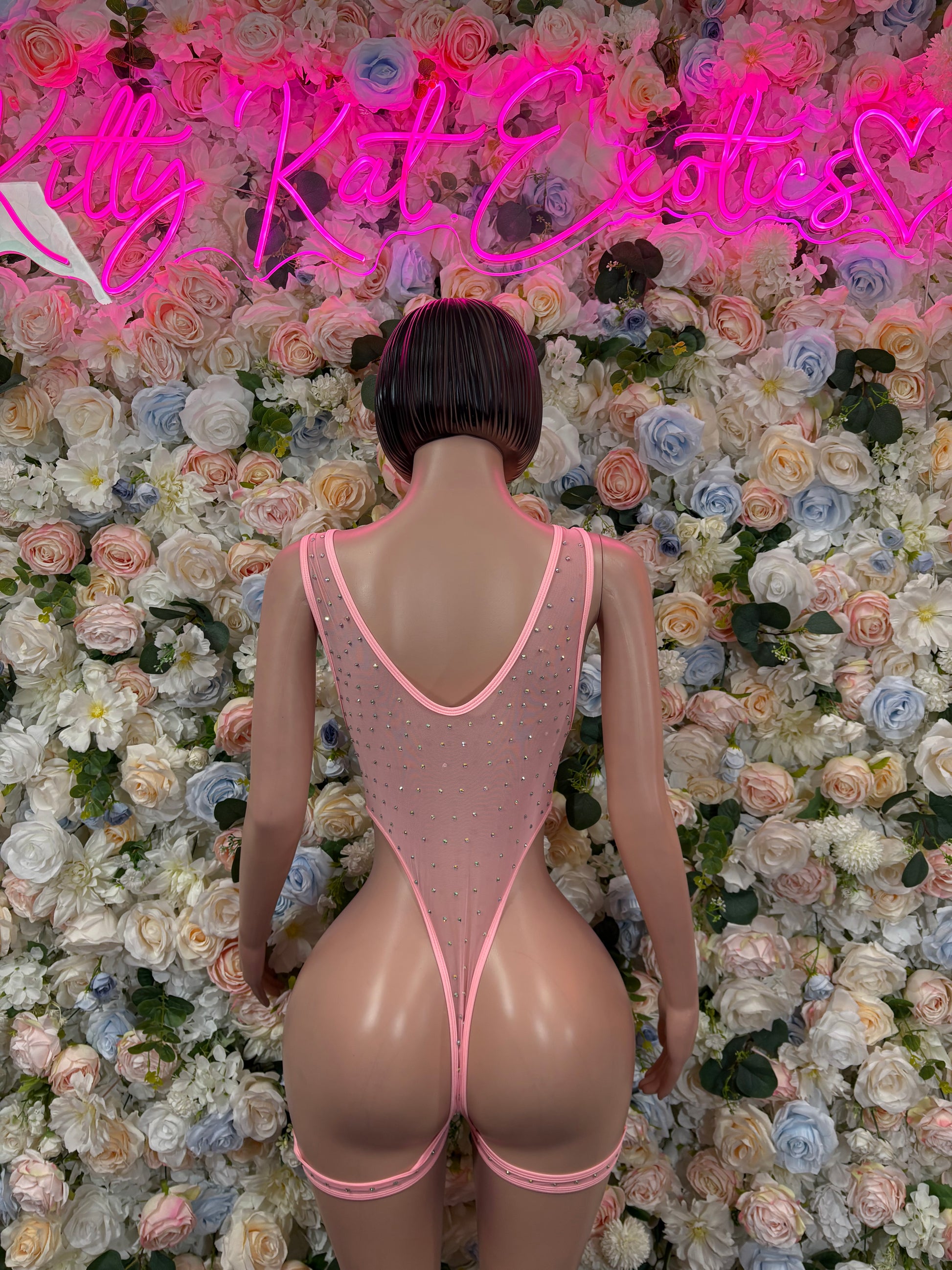 Pink rhinestone bodysuit with open back cutout, back view