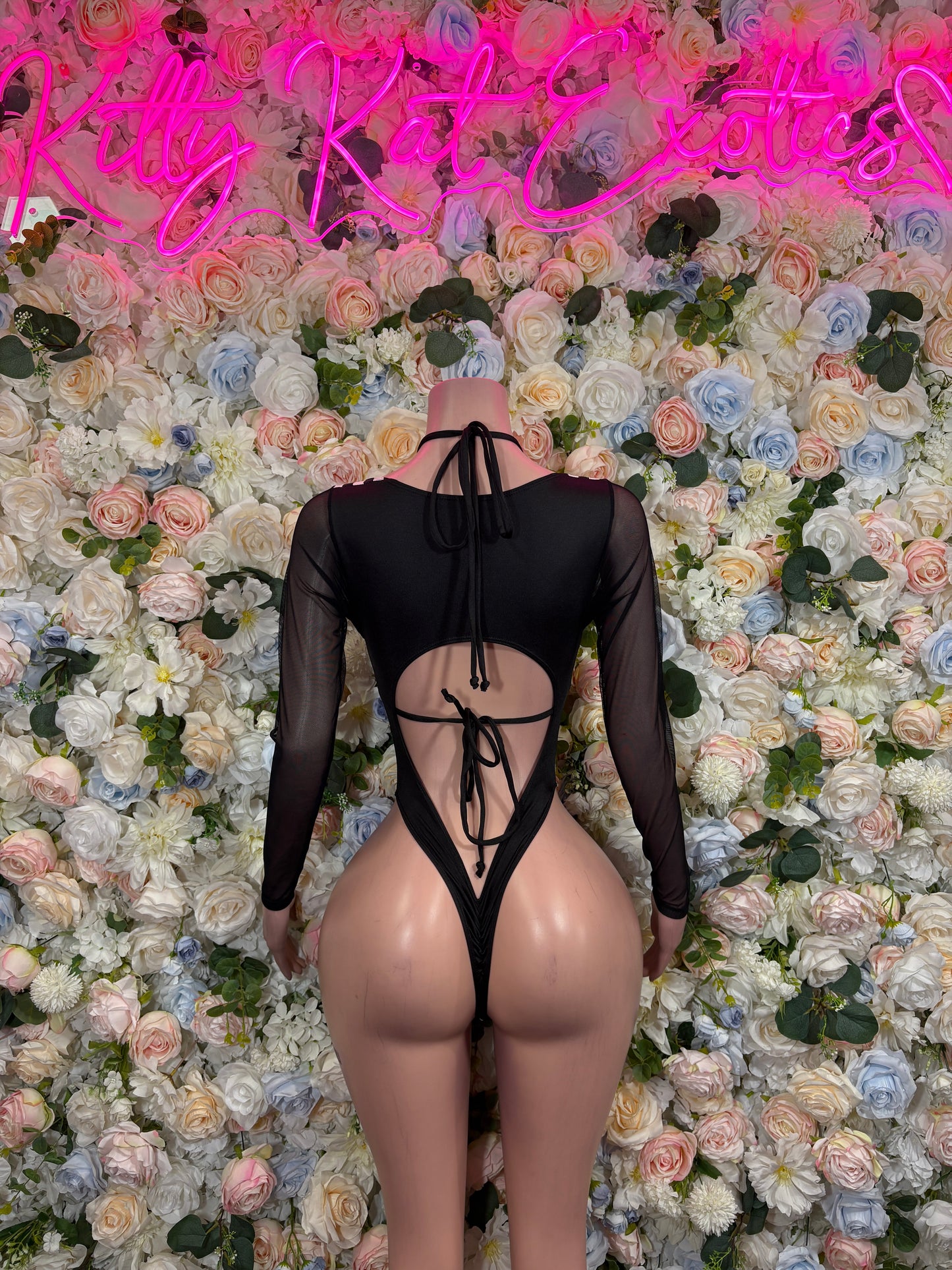 Black sheer long-sleeve bodysuit with central lace-up cutout