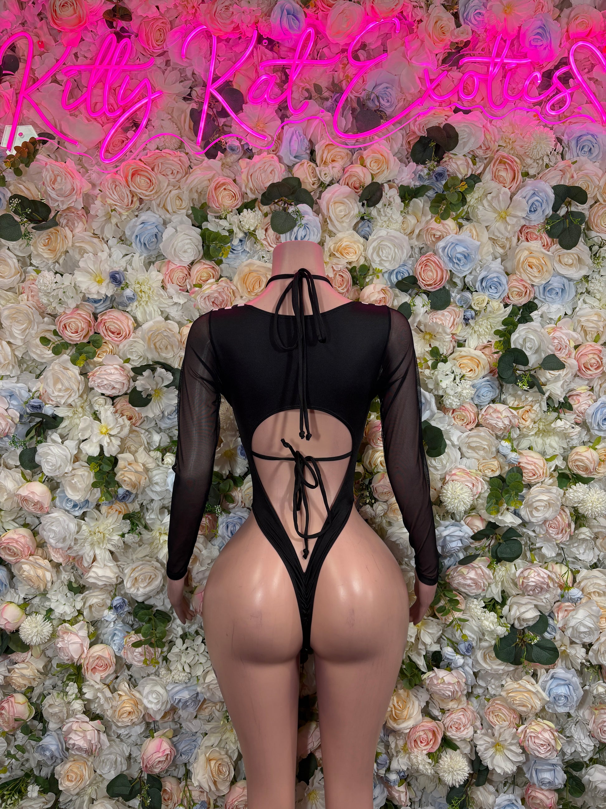 Black sheer long-sleeve bodysuit with central lace-up cutout