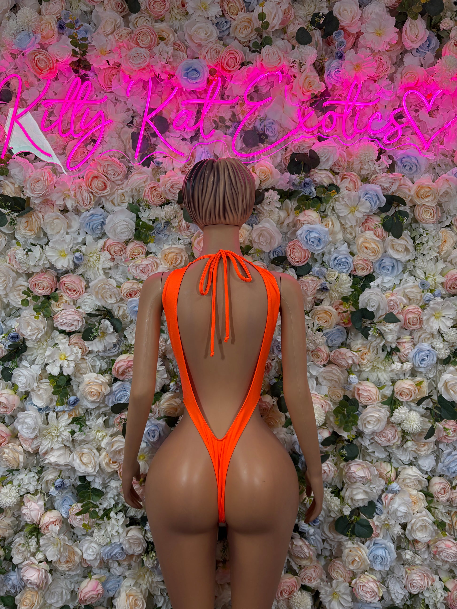 Orange backless one-piece bodysuit with V-back and center tie strings