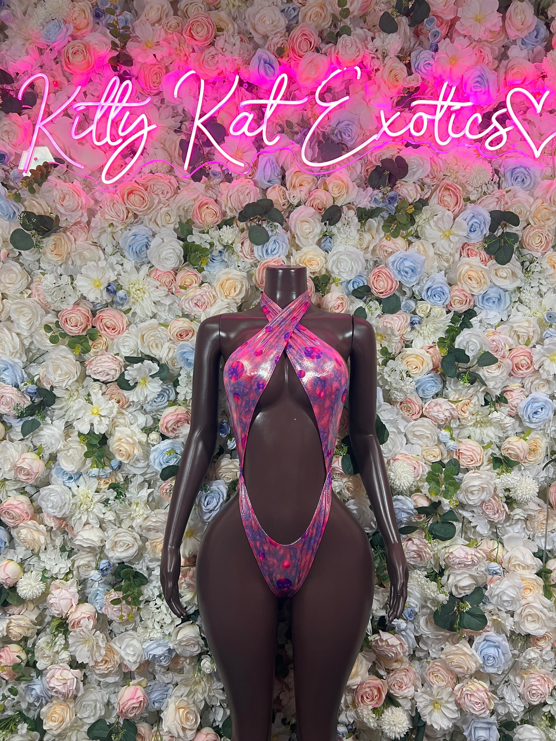 Metallic holographic halter bodysuit with oval keyhole cutout and pink-purple iridescent panels