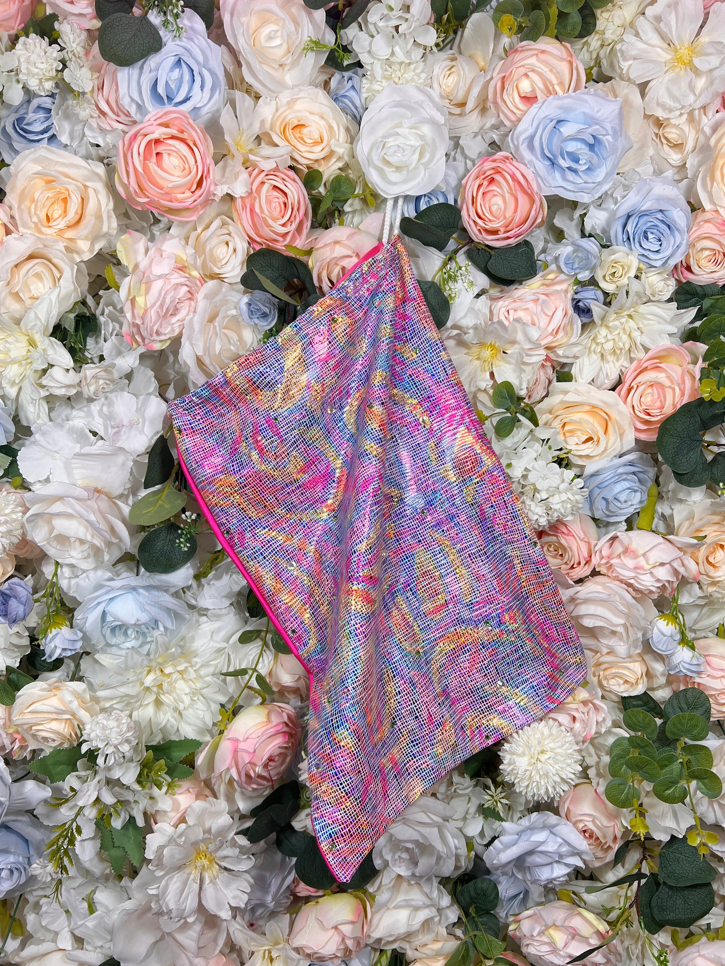 Multicolor metallic-pattern pouch bag with pink trim and slanted shape