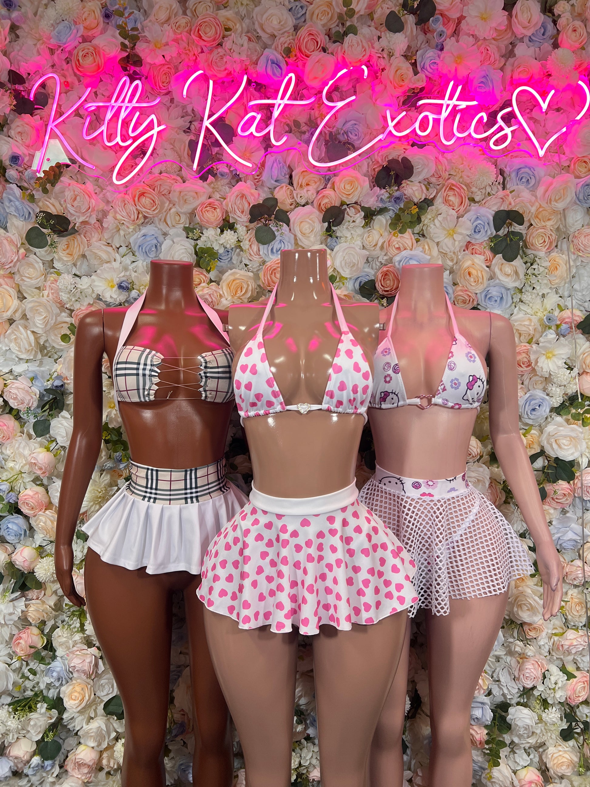 White and pink ruffled two-piece skirt set with halter bra and bow accents