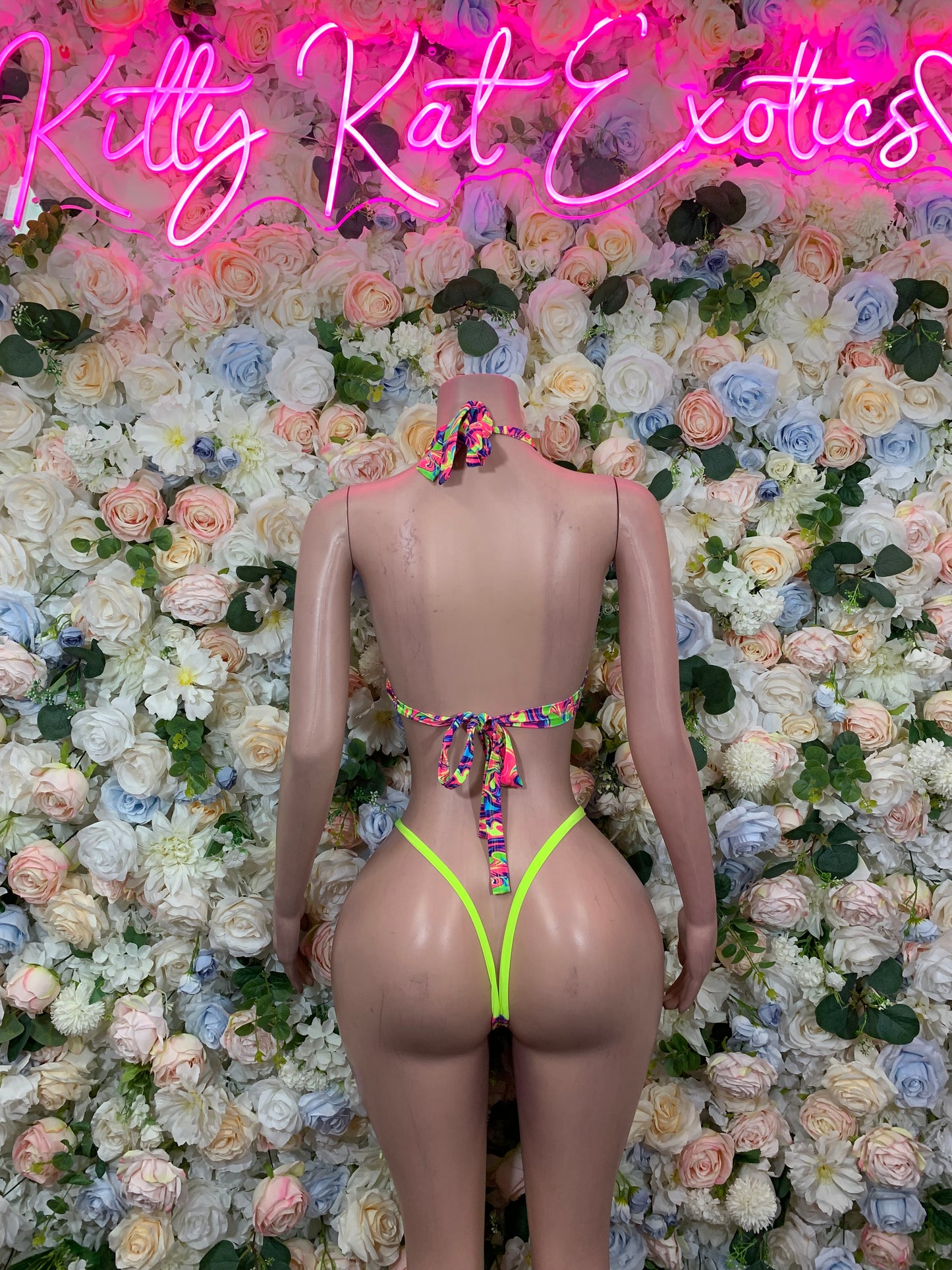 Multicolor two-piece festival swimsuit with neon-trim triangle bottom and backless top