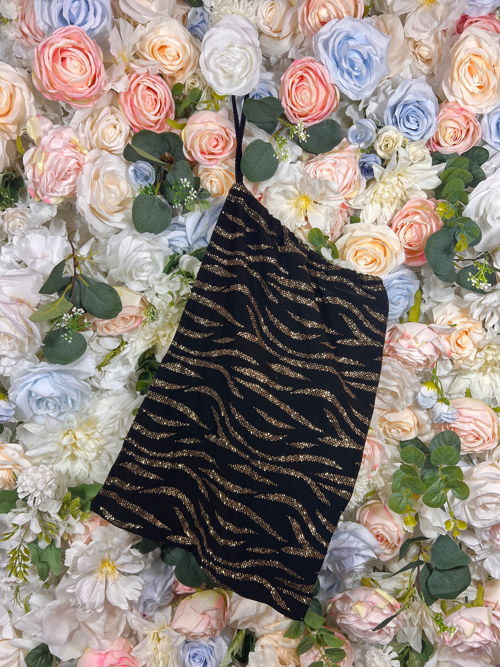 Black glitter money bag with gold wavy pattern and open top
