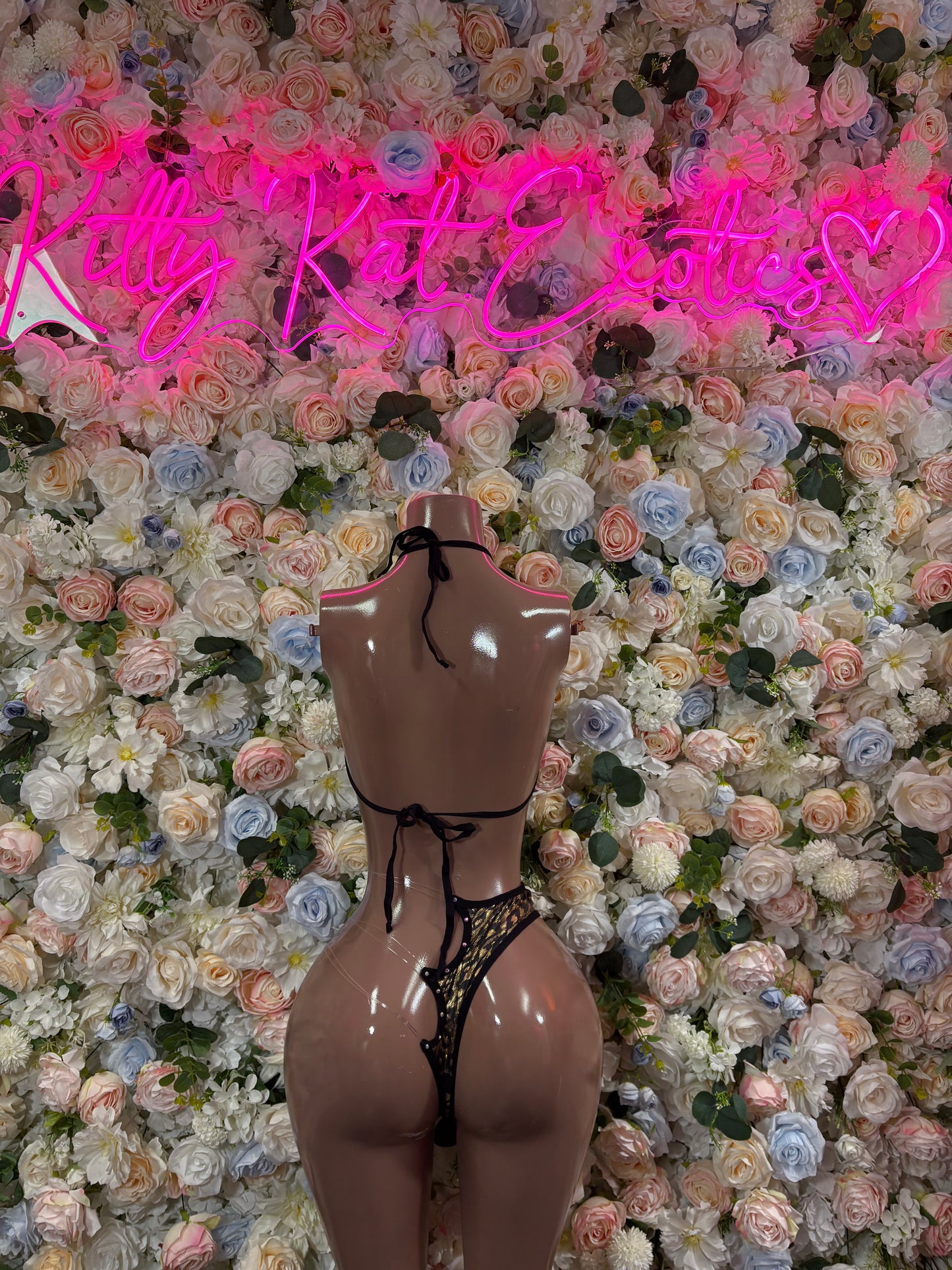 Black cheetah-print two-piece bodysuit with tie strings and thong bottom