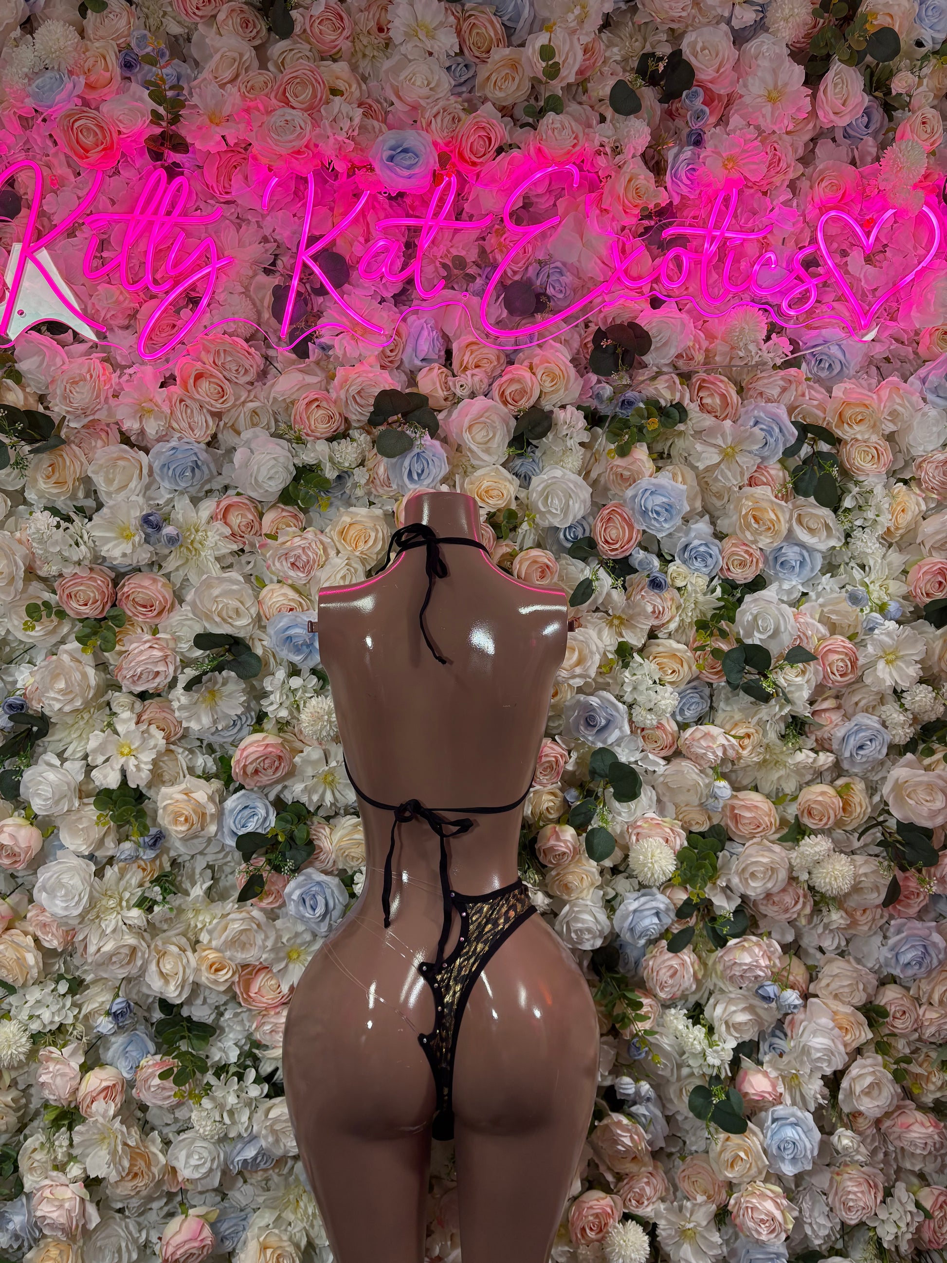 Black cheetah-print two-piece bodysuit with tie strings and thong bottom