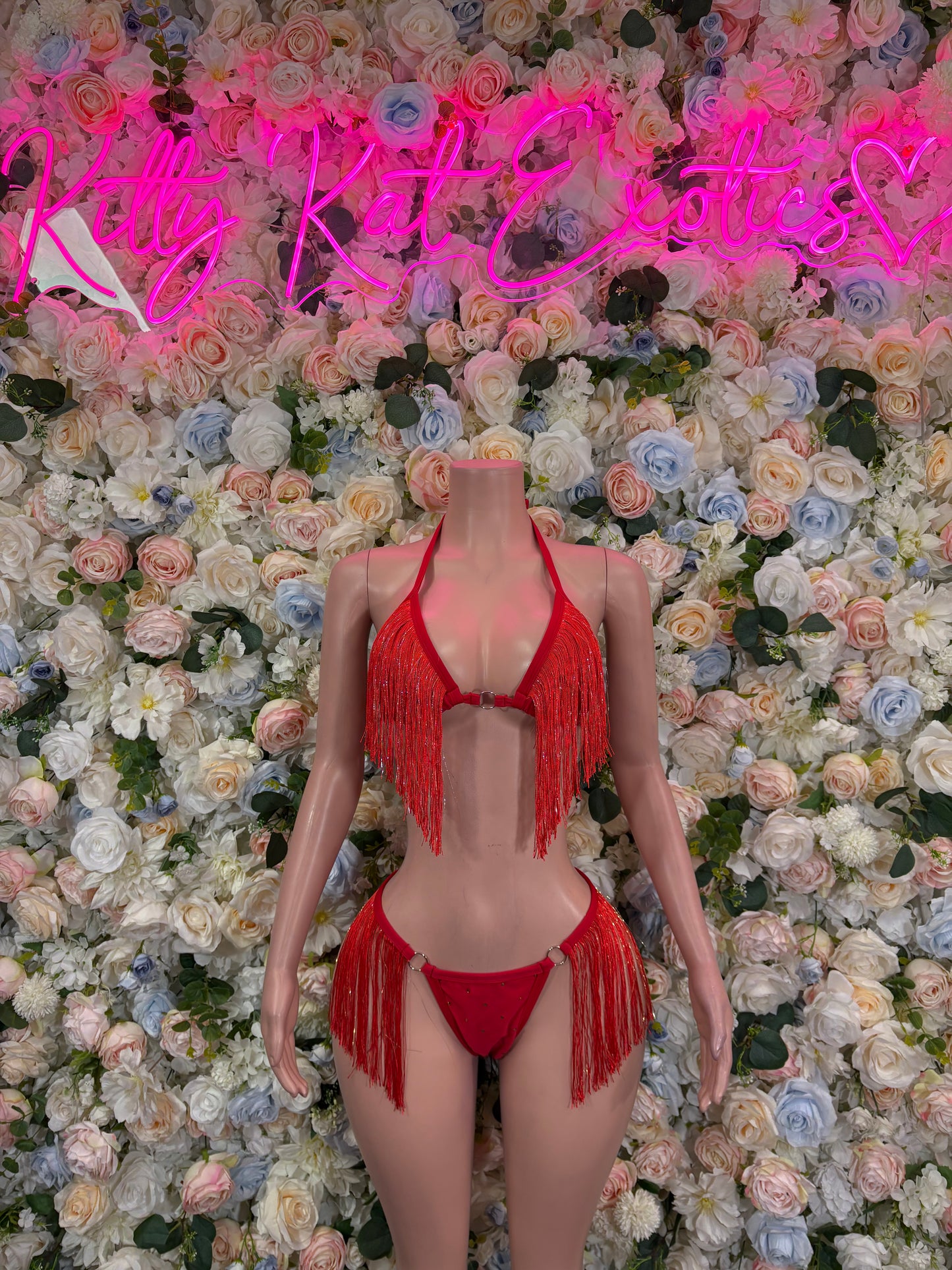 Red fringe two-piece bikini set with triangle top, tassels, and matching tie-side bottoms