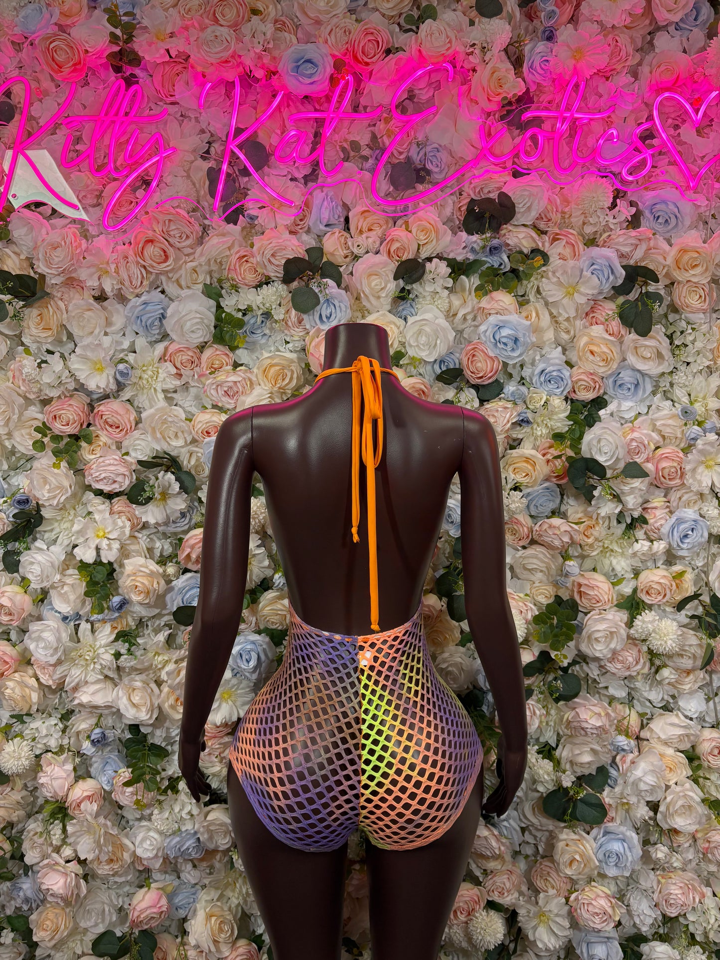 Orange fishnet bodysuit back with straps and multicolor trim