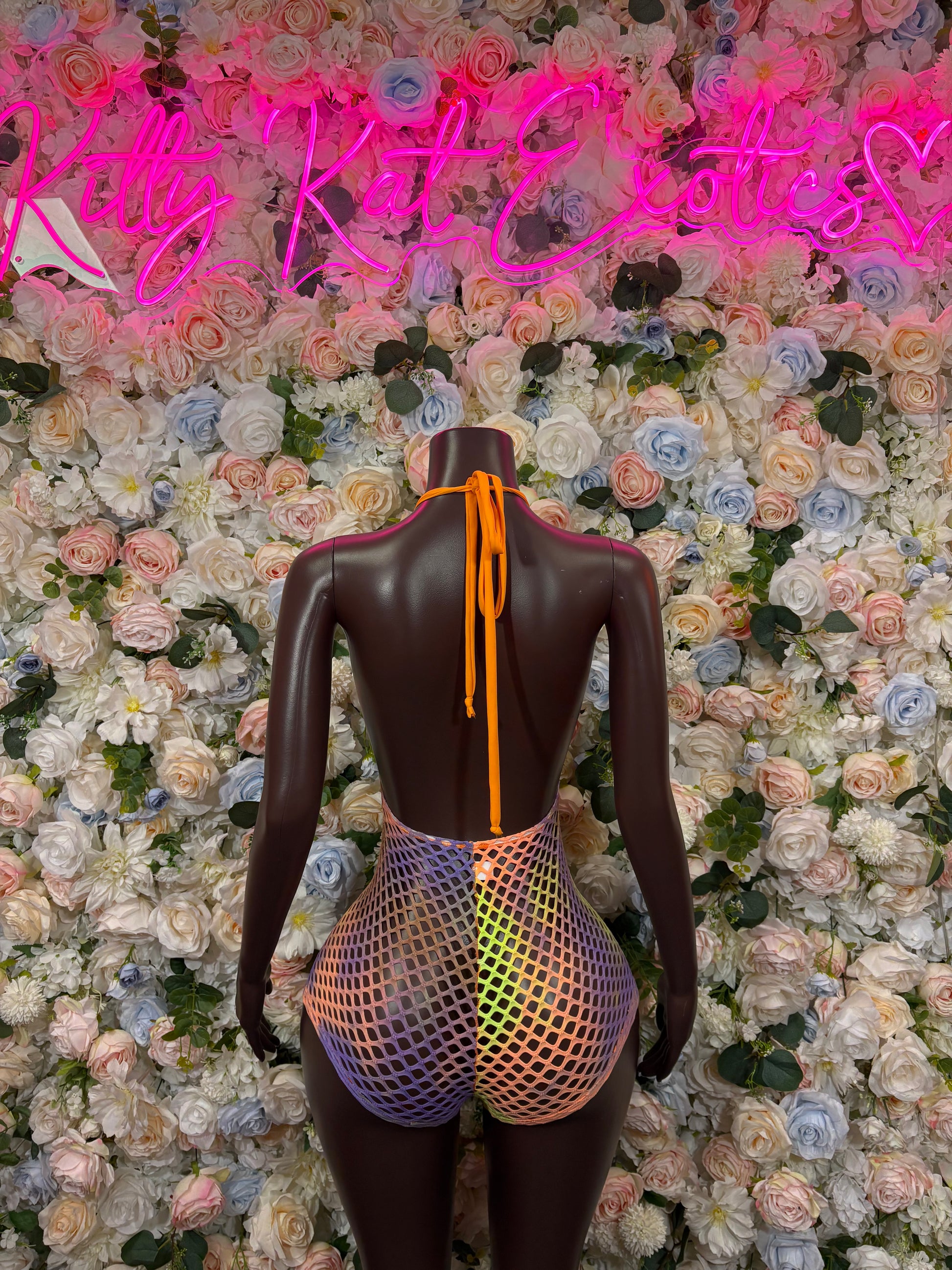 Orange fishnet bodysuit back with straps and multicolor trim