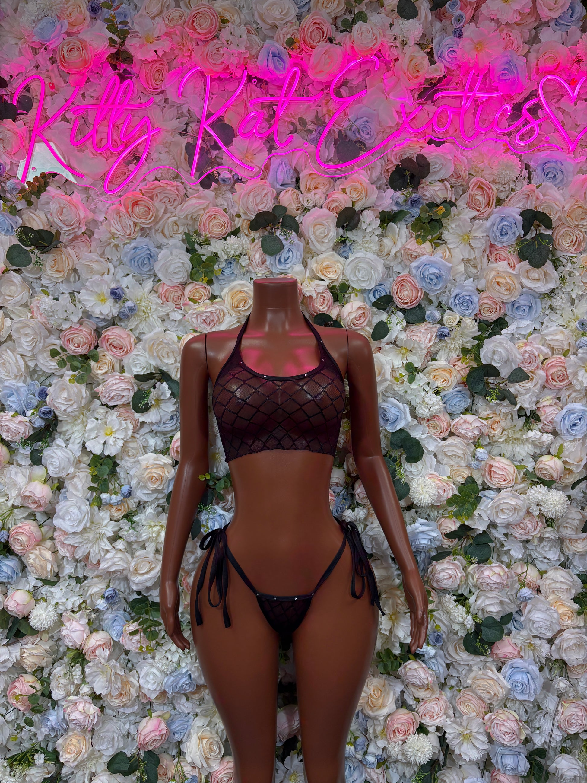 Black two-piece lace mesh bikini with high-cut bottoms and tie details