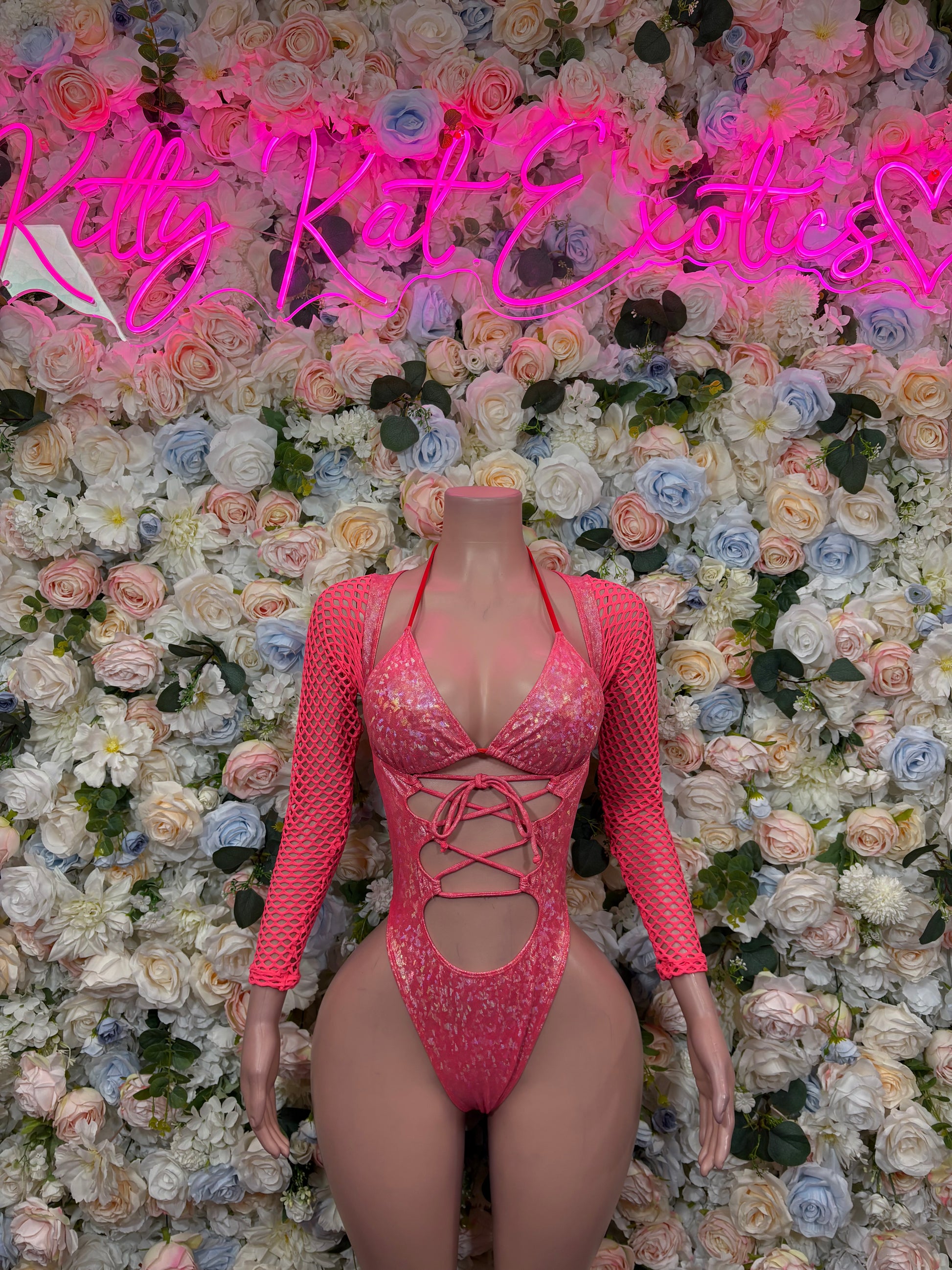 Pink metallic crushed bodysuit with long sleeves, V-neck, lace-up front cutout
