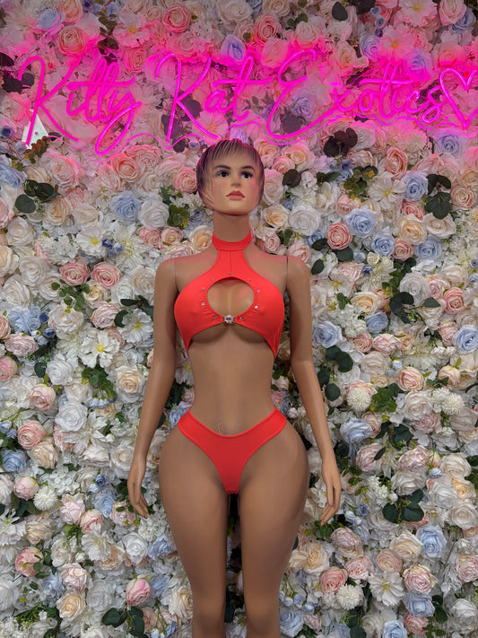 Orange bikini two-piece set with triangle top and high-cut cheeky bottoms