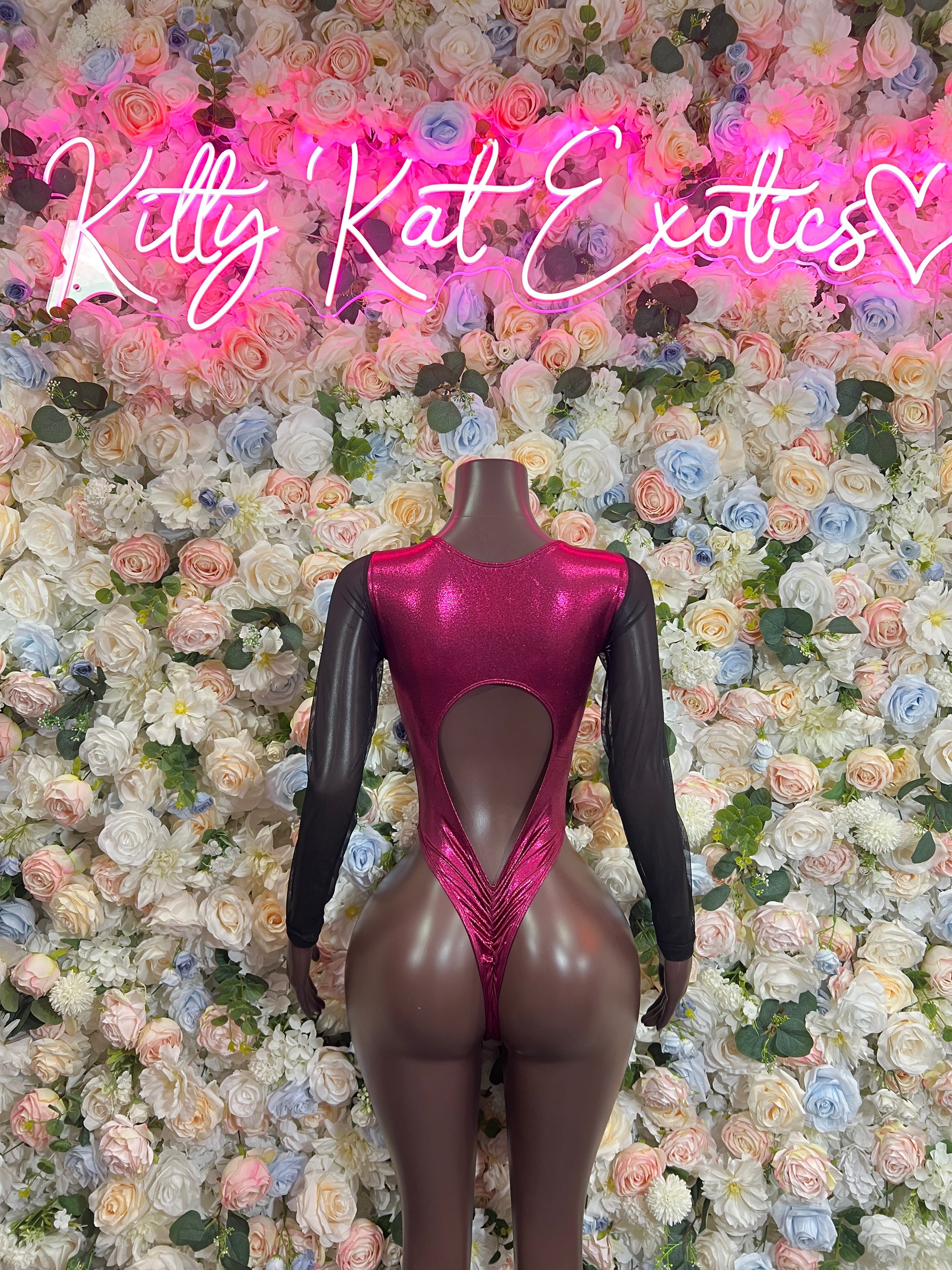 Burgundy bodysuit with long sheer sleeves and heart-shaped chest cutout